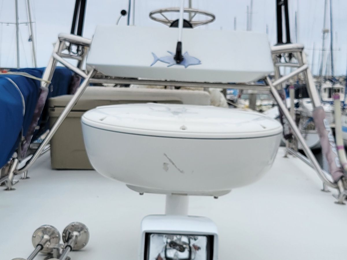 A 2008 Davis-Radon RockHarbor Long Cabin boat with radar equipment and a fish symbol on the roof.