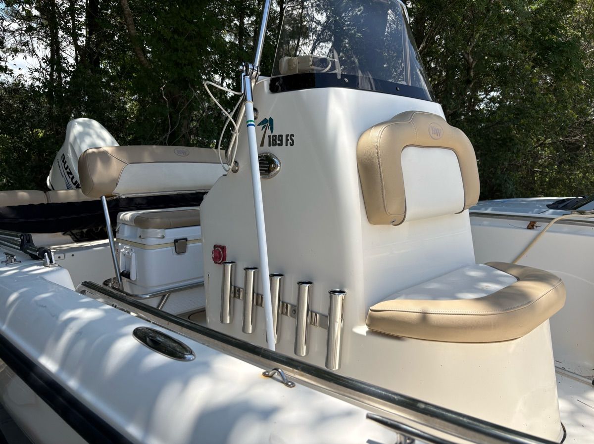 The image shows a 2016 Key West 189 FS boat with beige upholstery and fishing rod holders.