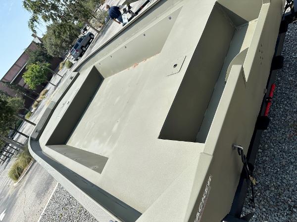 2025 Tracker GRIZZLY 2072 Utility boat on trailer, outdoor setting.