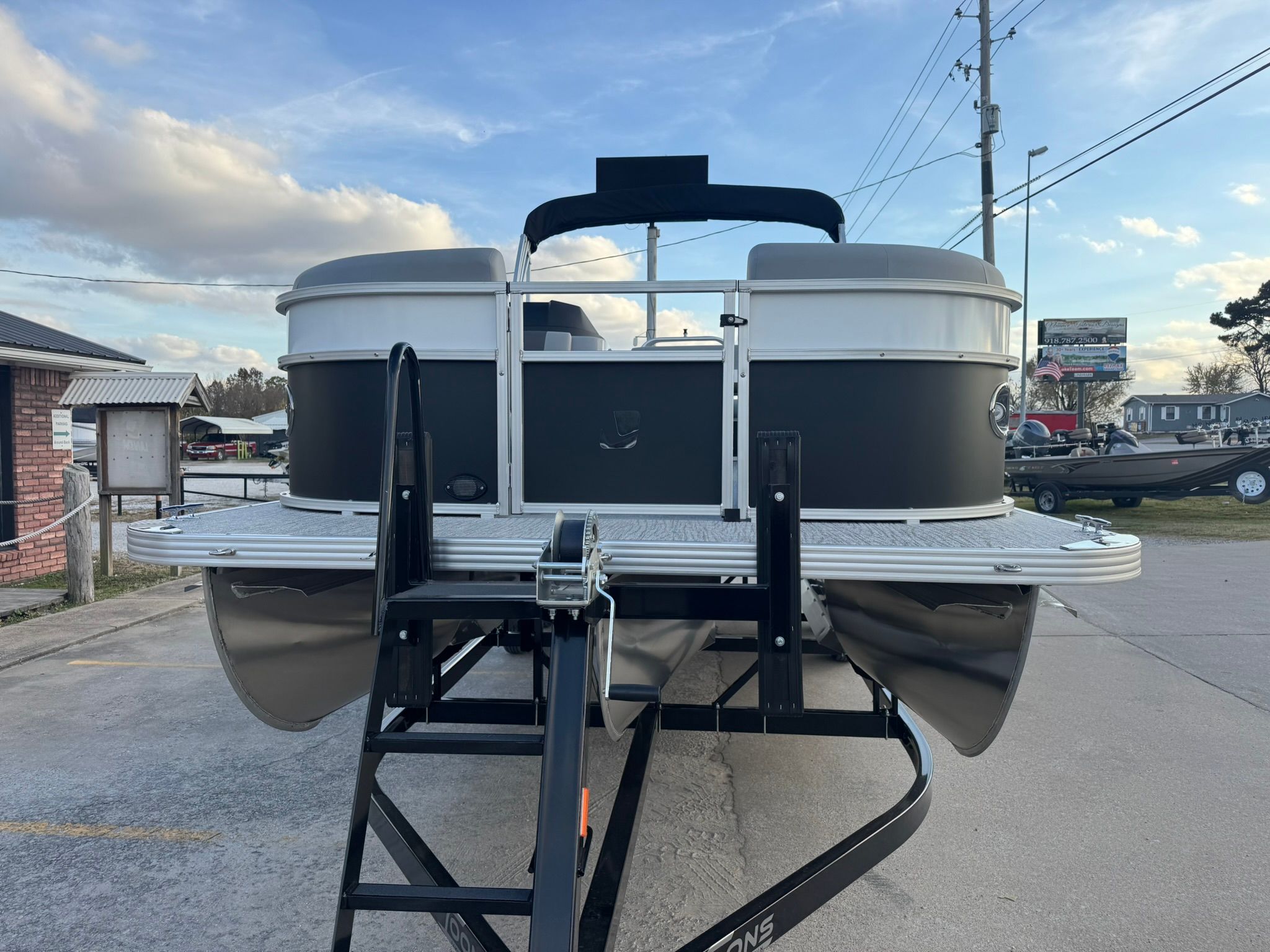 2026 Landau 23 Island Breeze pontoon boat on trailer.