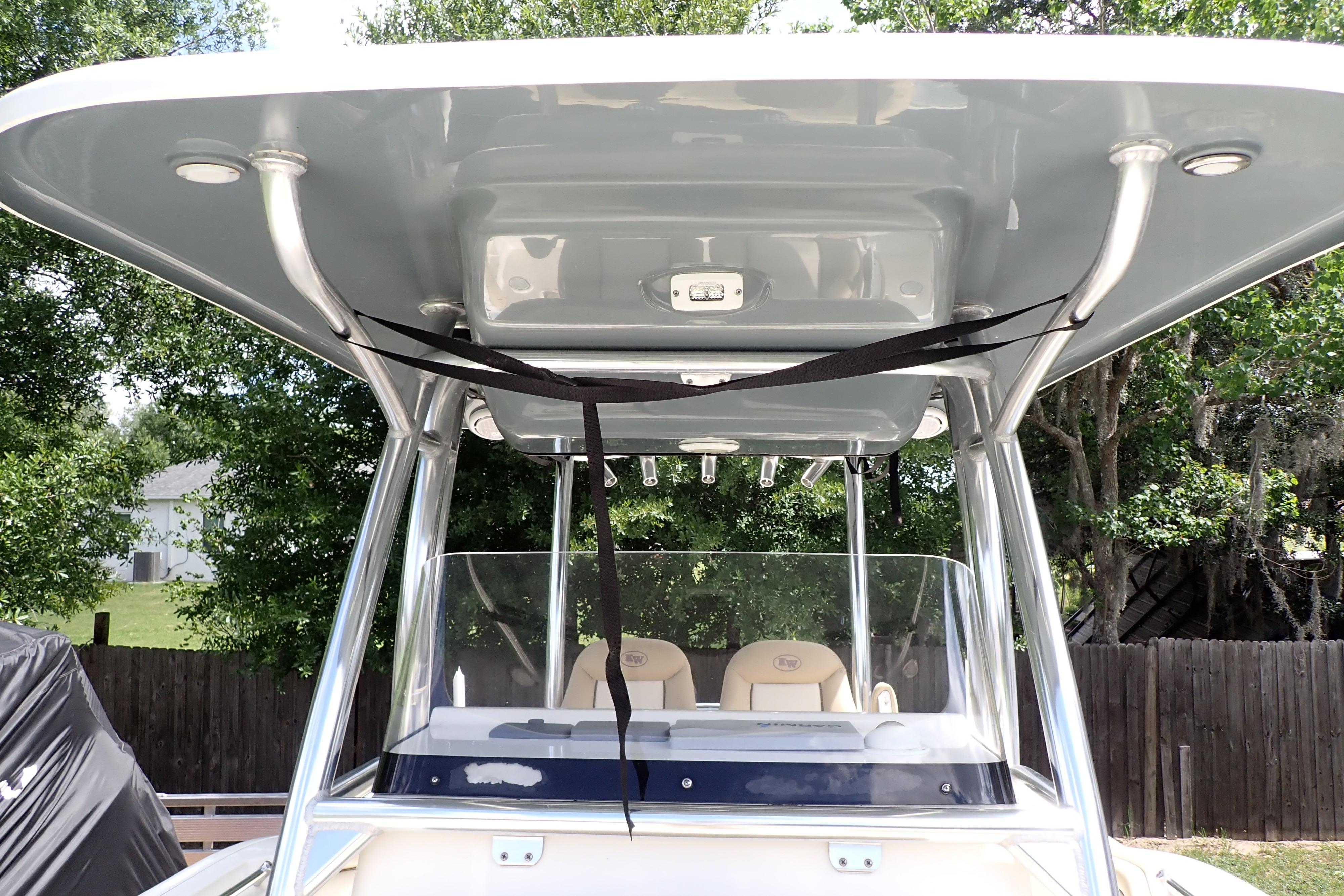 2019 Key West 263 FS boat with T-top and seating, parked outdoors.