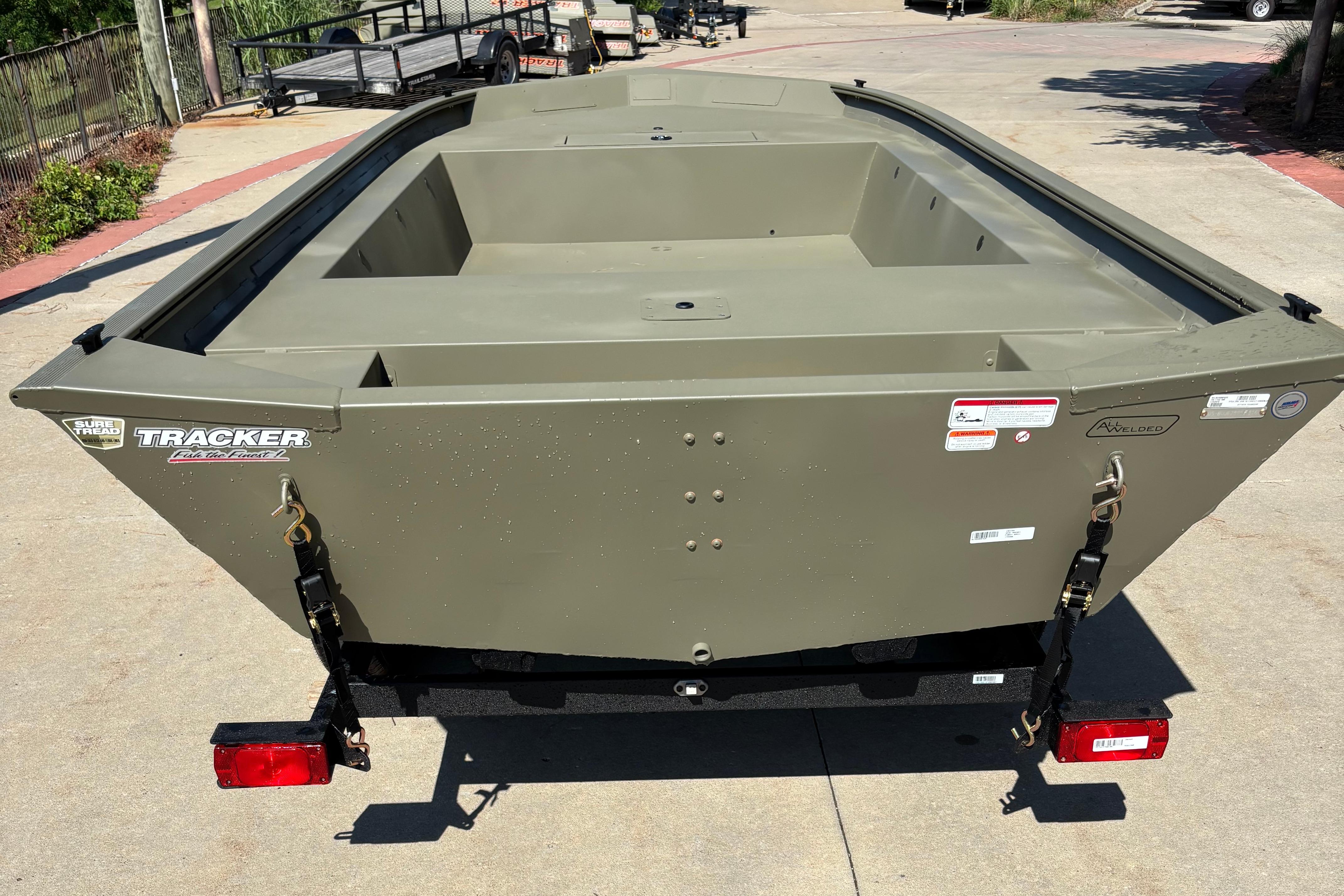 2026 Tracker Grizzly 1754 Utility boat on trailer, rear view, outdoors.