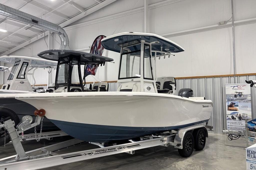 2026 Tidewater 198 CC Adventure boat displayed in a showroom on a trailer.