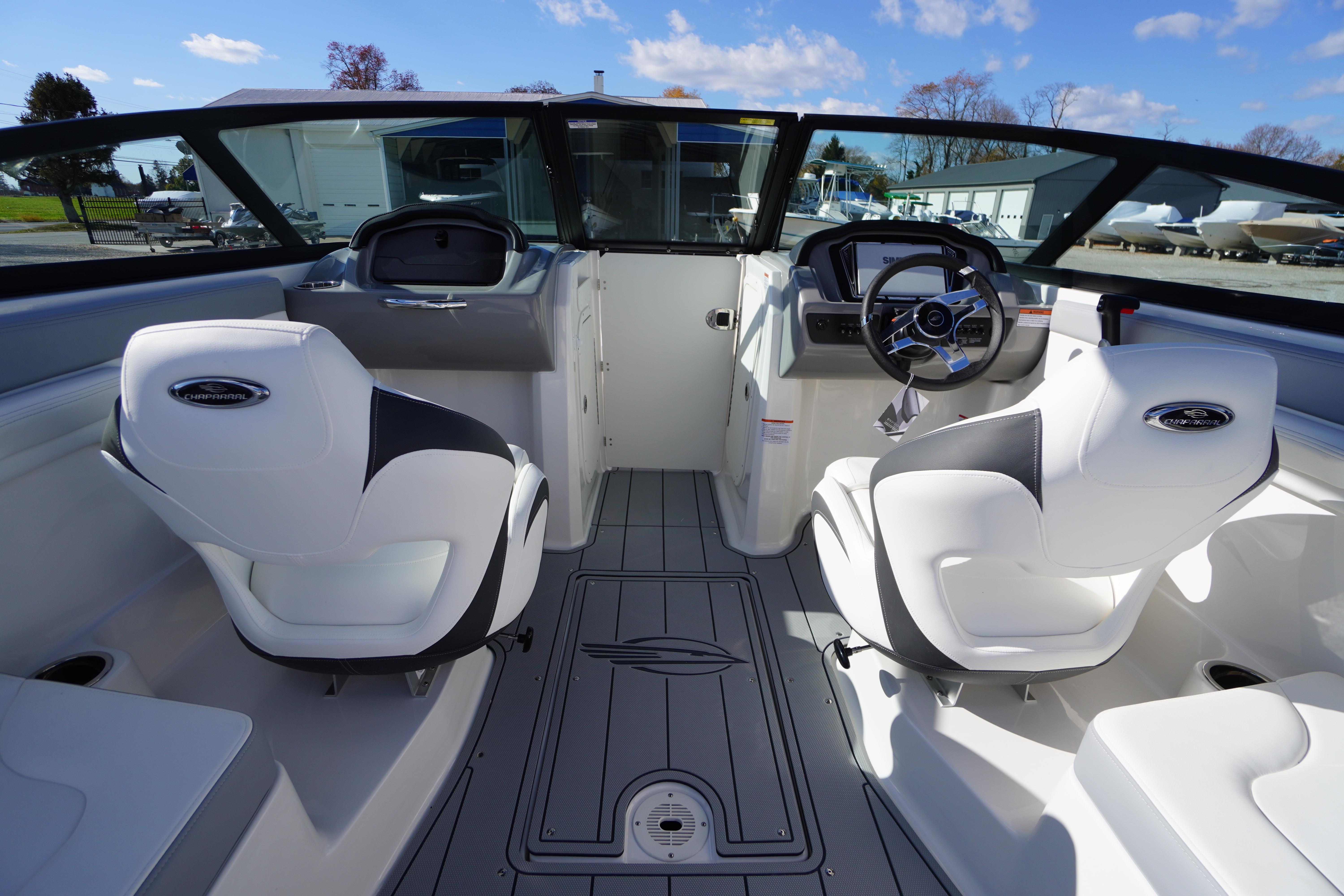 Interior of 2026 Chaparral 23 SSi OB boat with modern seating and steering console.