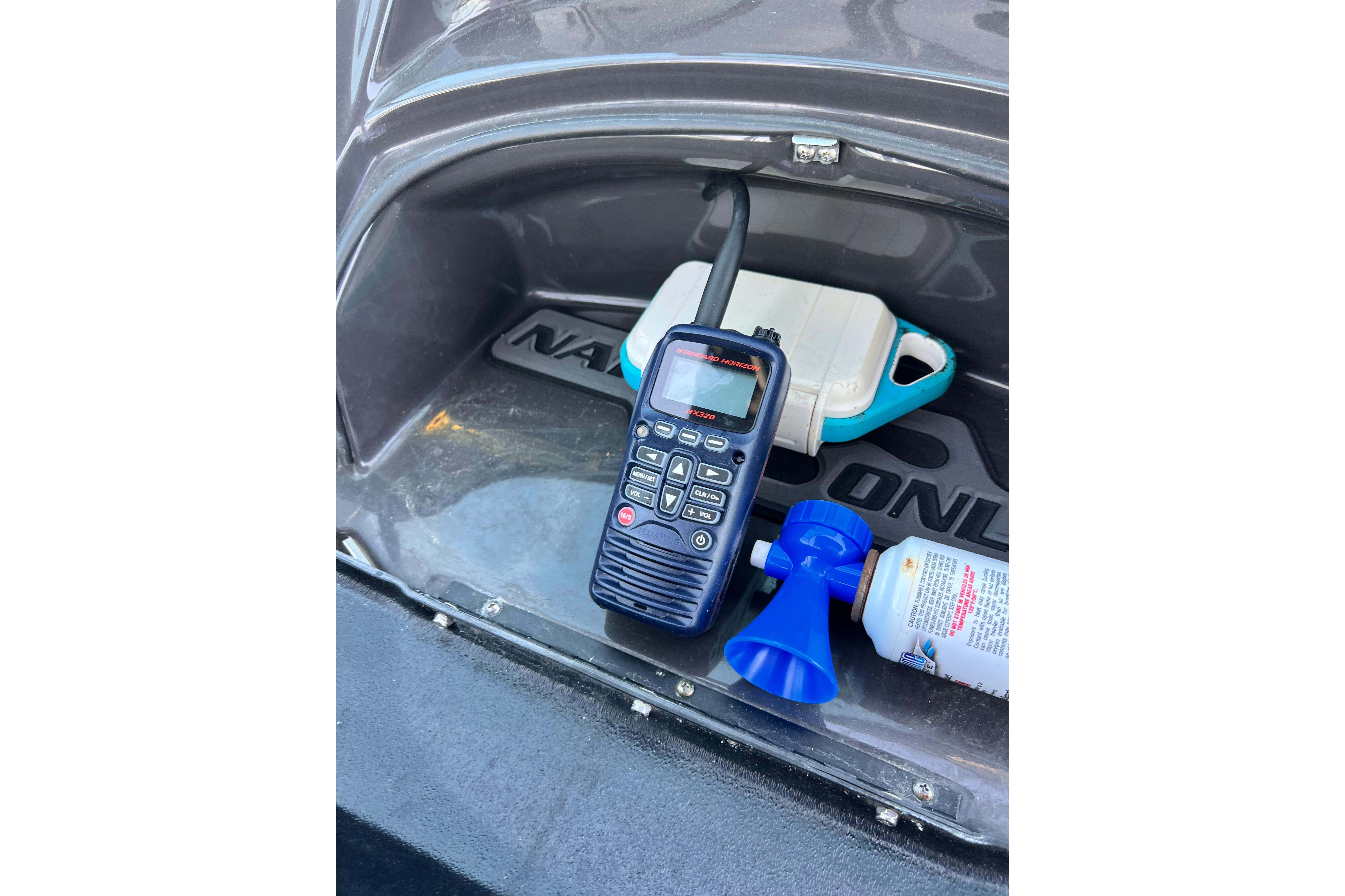 Storage compartment of 2015 Monterey 268SS Super Sport with radio and air horn.
