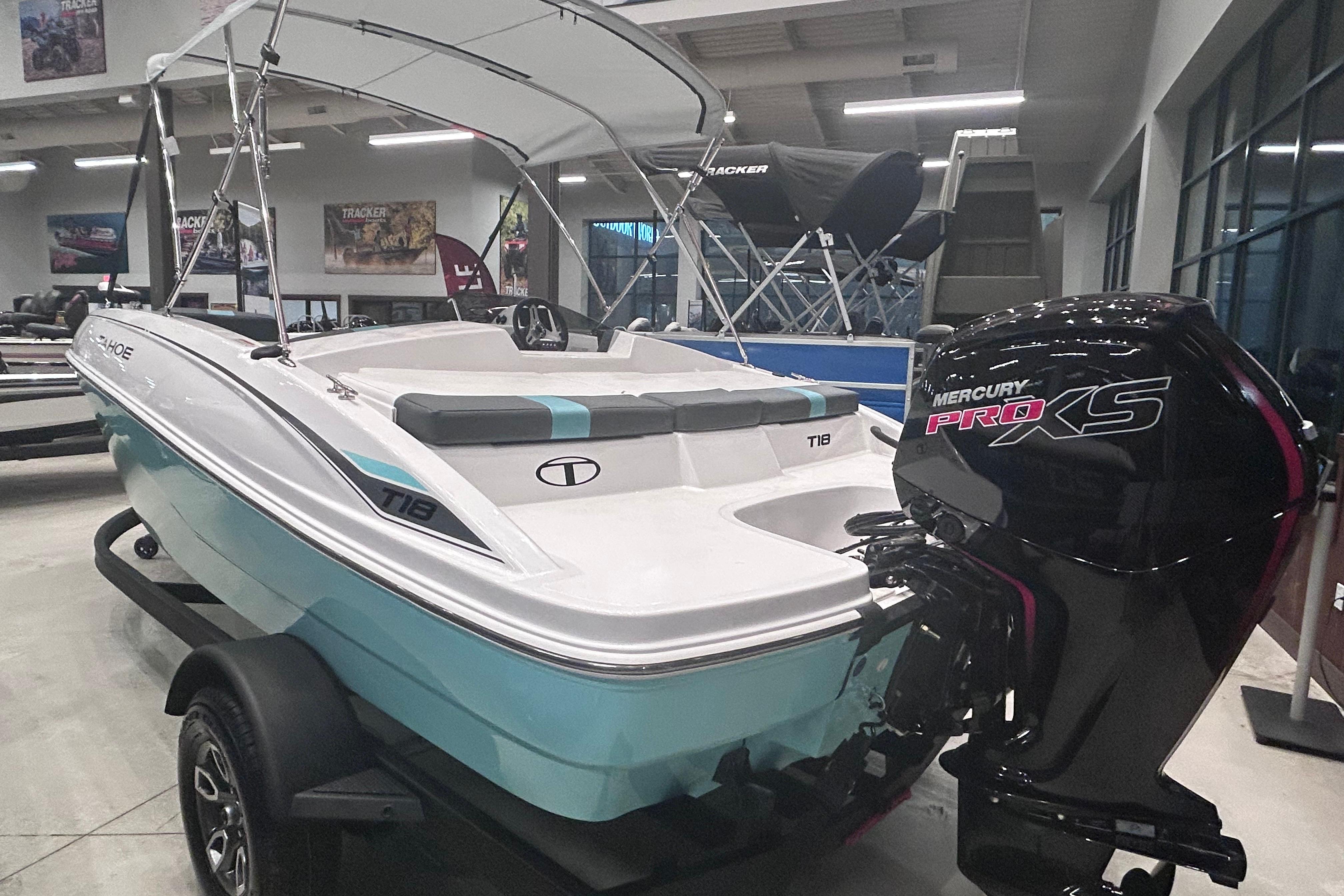 2026 Tahoe T18 boat with Mercury Pro XS engine in showroom display.