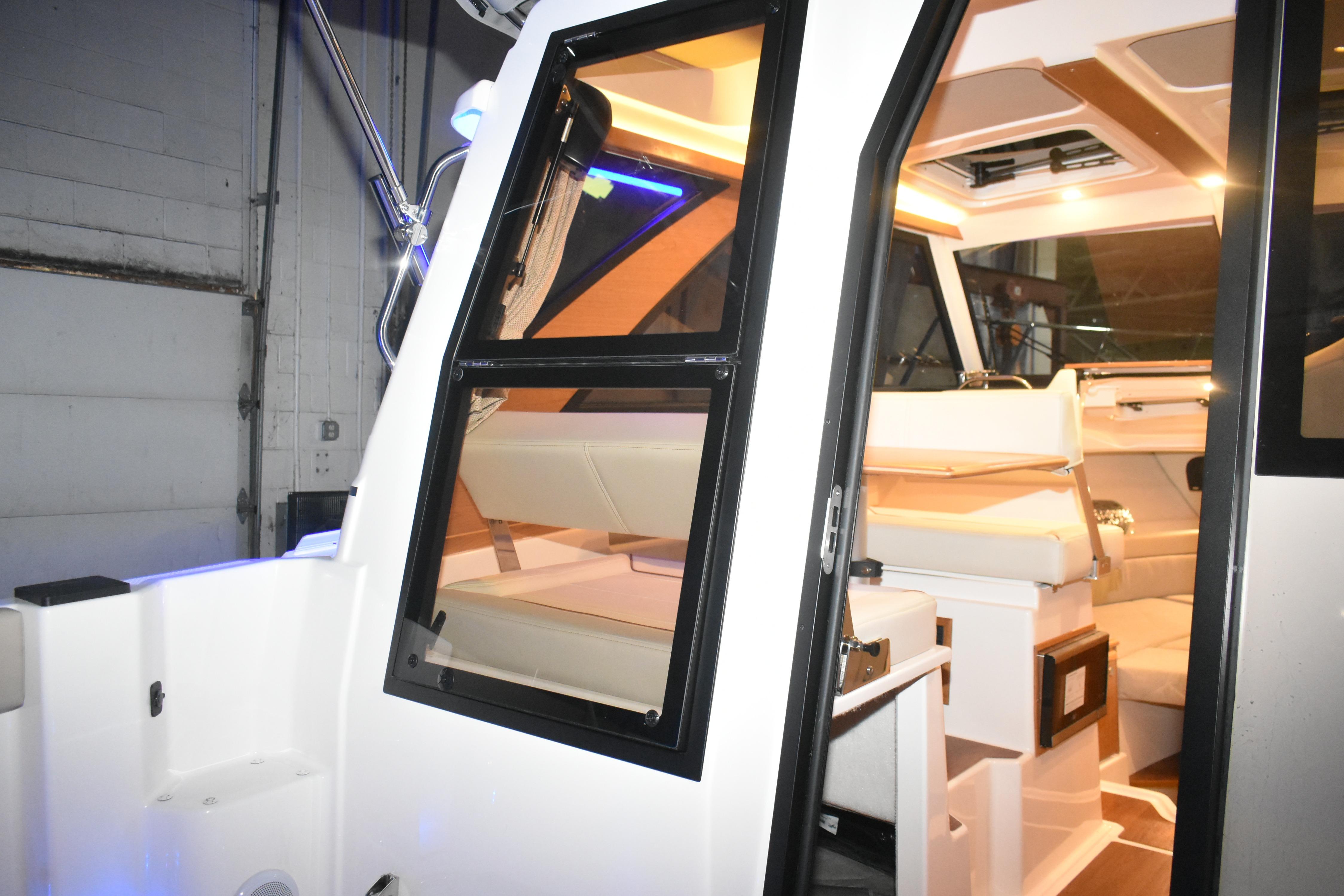 Interior view of 2026 Cutwater C-248 Coupe boat, showcasing seating and cabin design.
