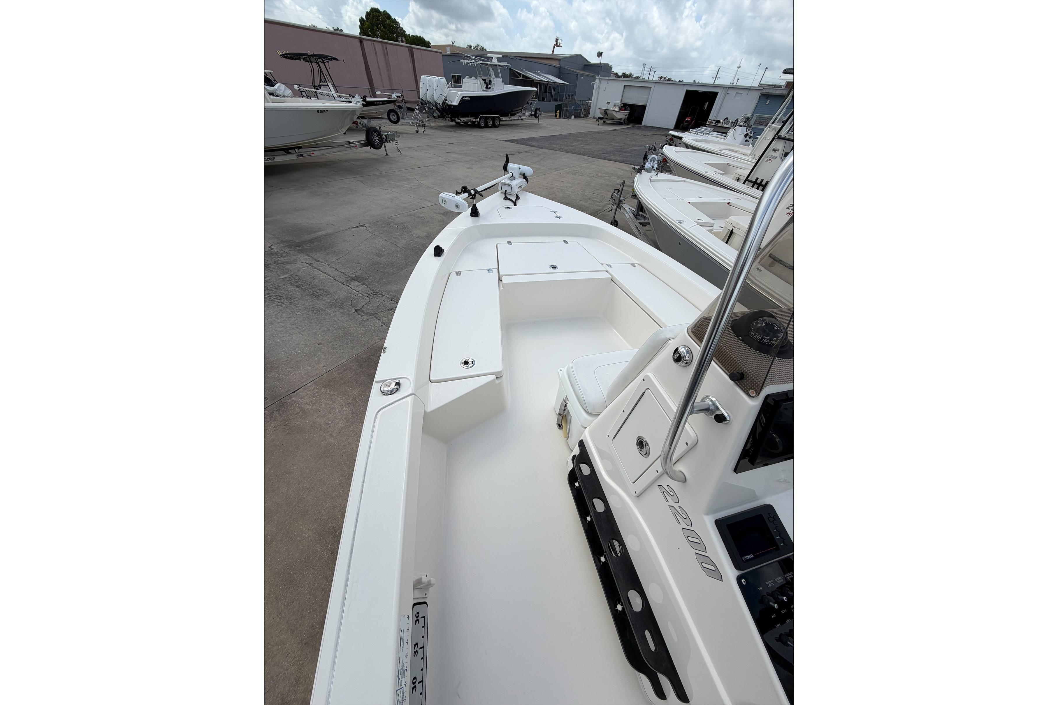 2017 Pathfinder 2200 TRS boat docked, showcasing spacious deck and sleek design.