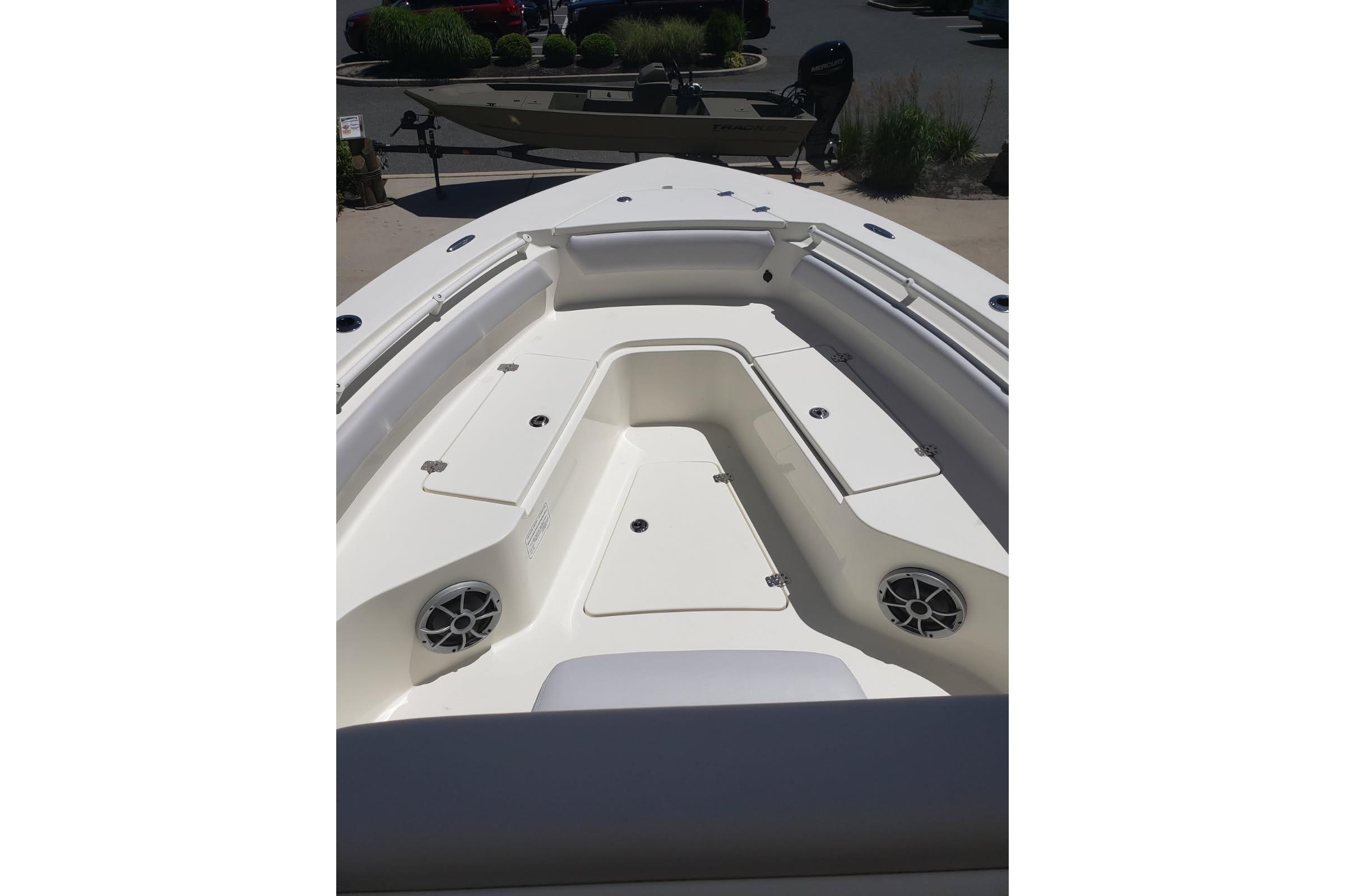 2026 Mako 226 Center Console boat interior with seating and storage compartments.