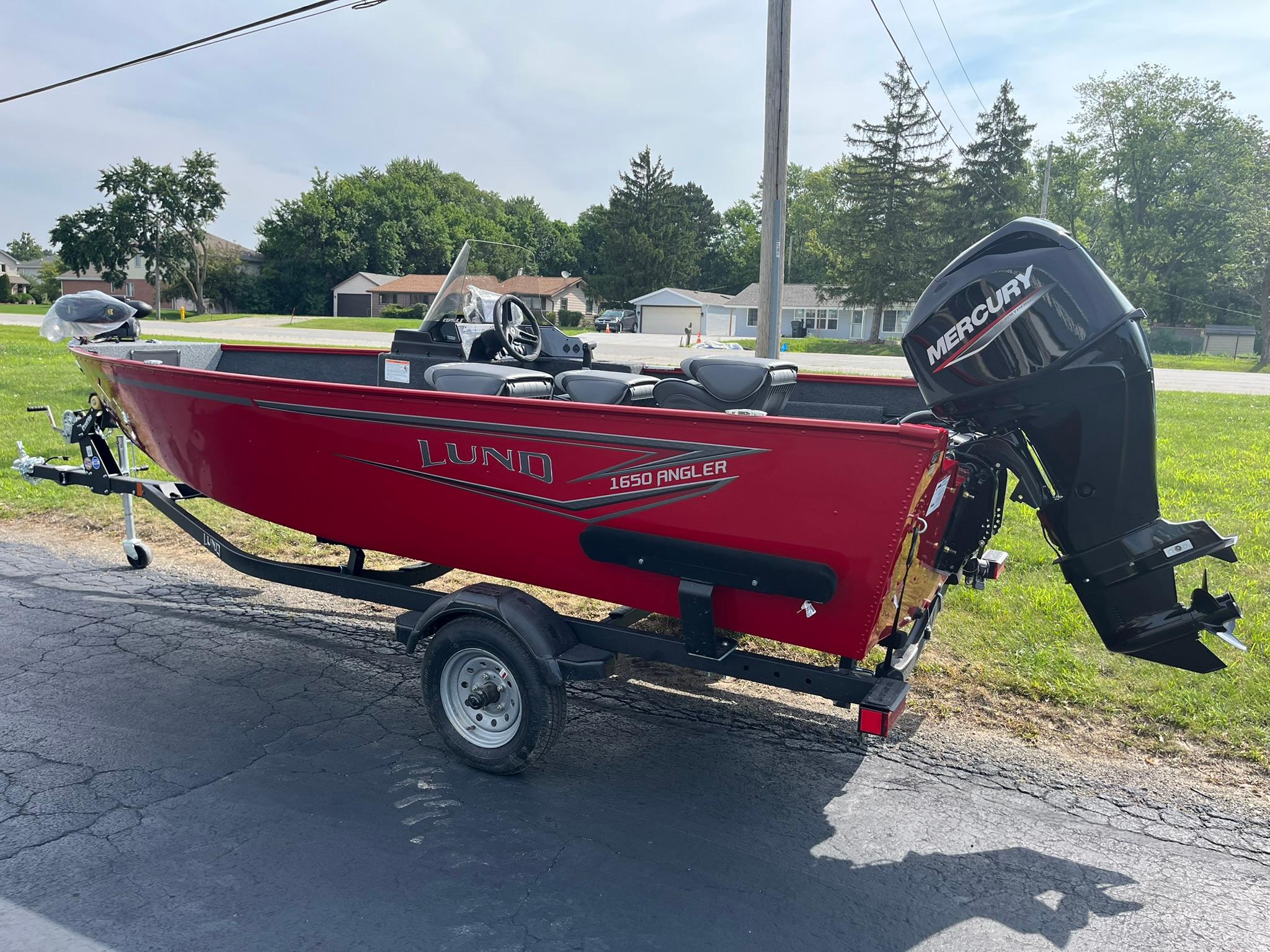 2026 Lund 1650 Angler SS boat with Mercury outboard motor on trailer.