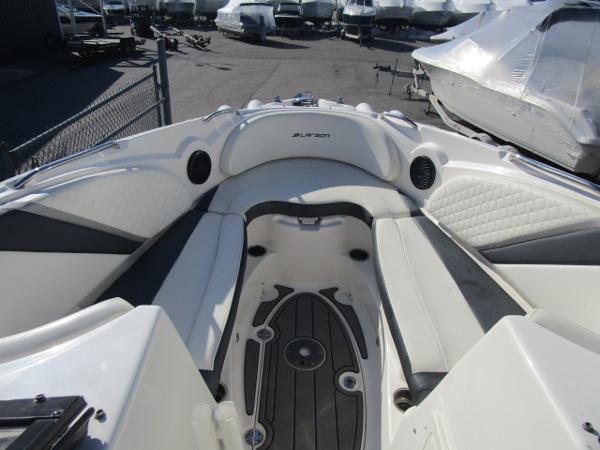 2017 Larson 292 LXI boat interior with white seating and black accents.