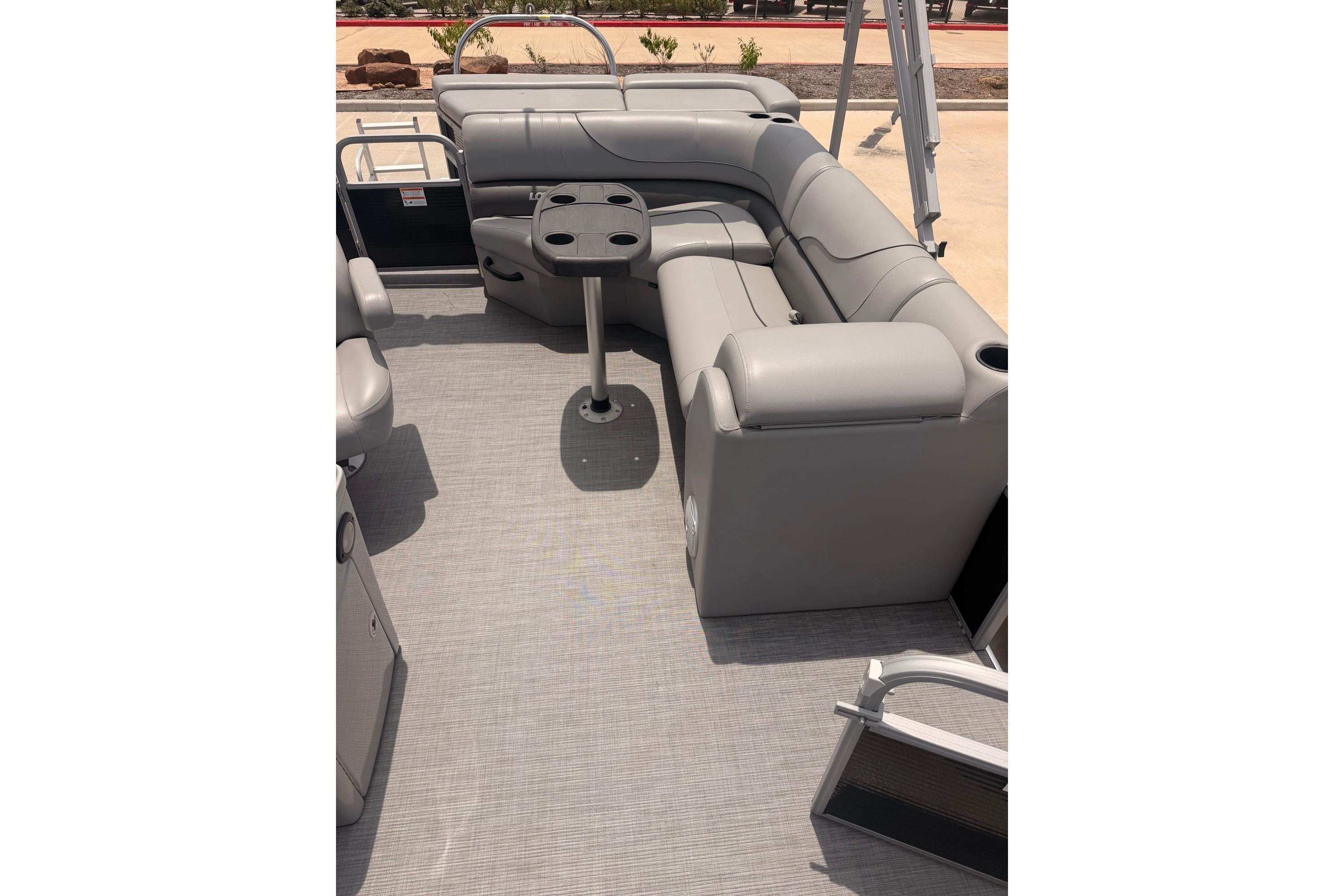 2021 Lowe SS 210 pontoon boat interior with gray seating and table.