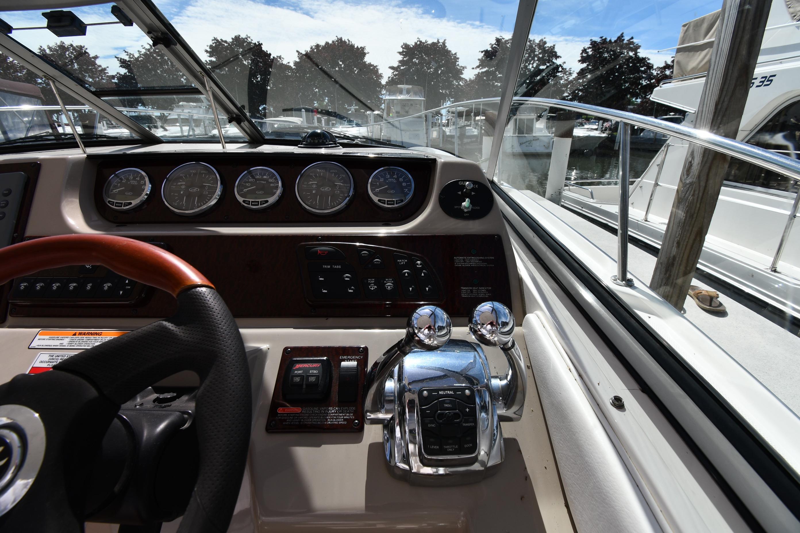 Cockpit view of 2008 Sea Ray Sundancer 350 with steering wheel and control panel.