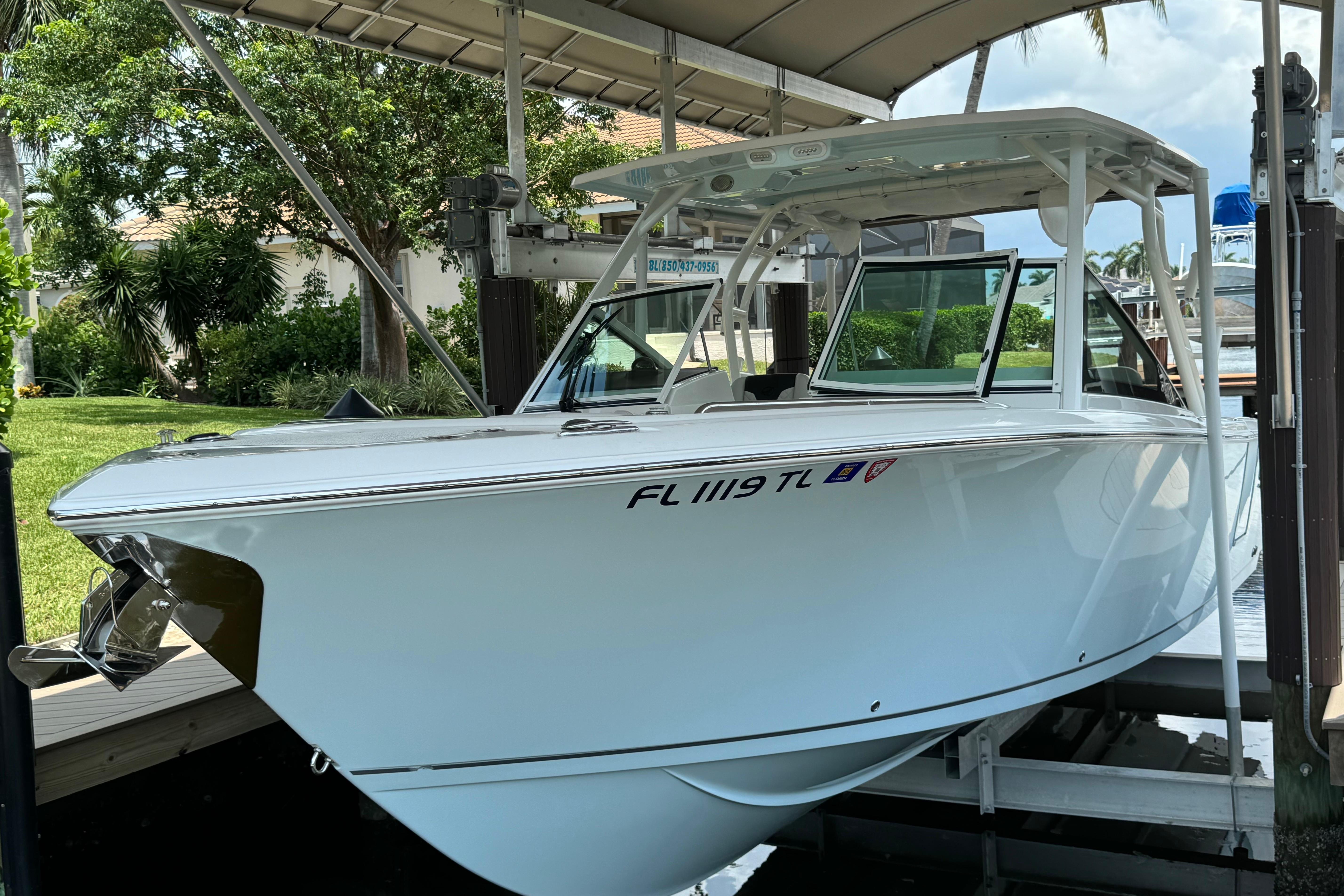 2021 Sailfish 276 DC boat docked, showcasing sleek design and modern features.
