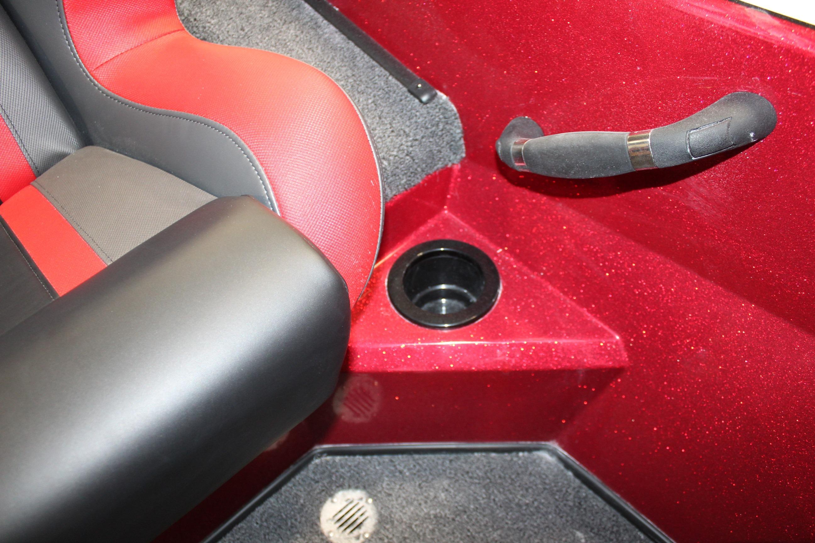 2026 Nitro Z19 XL Pro boat interior with red and black seating, cup holder, and handle.
