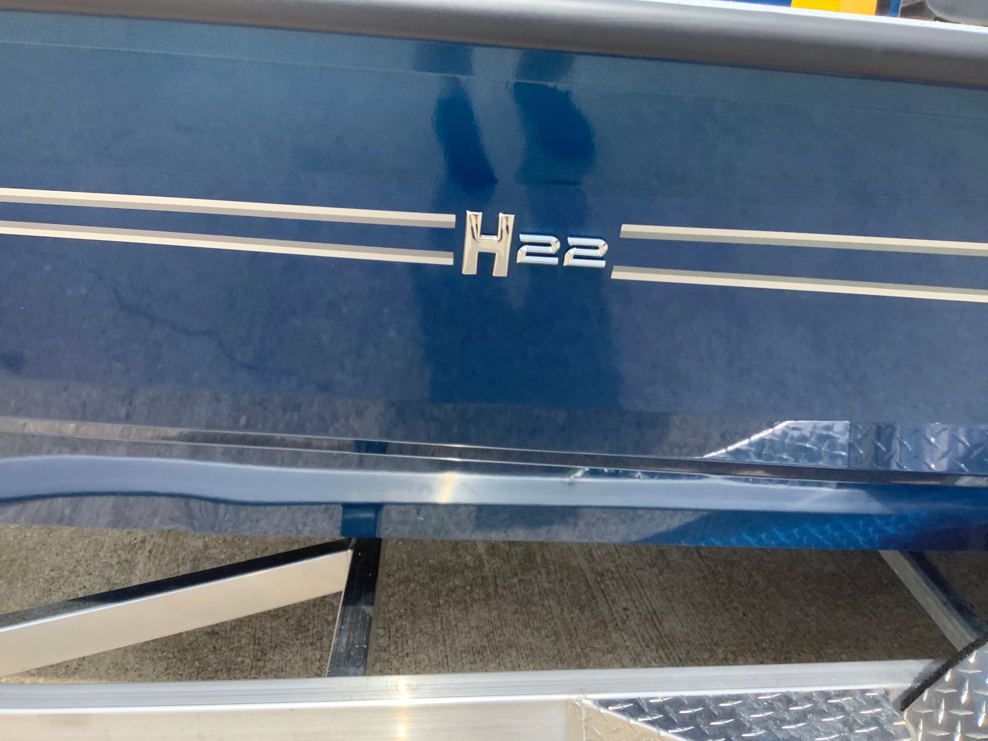 2026 Xpress H22B Bay boat on trailer.