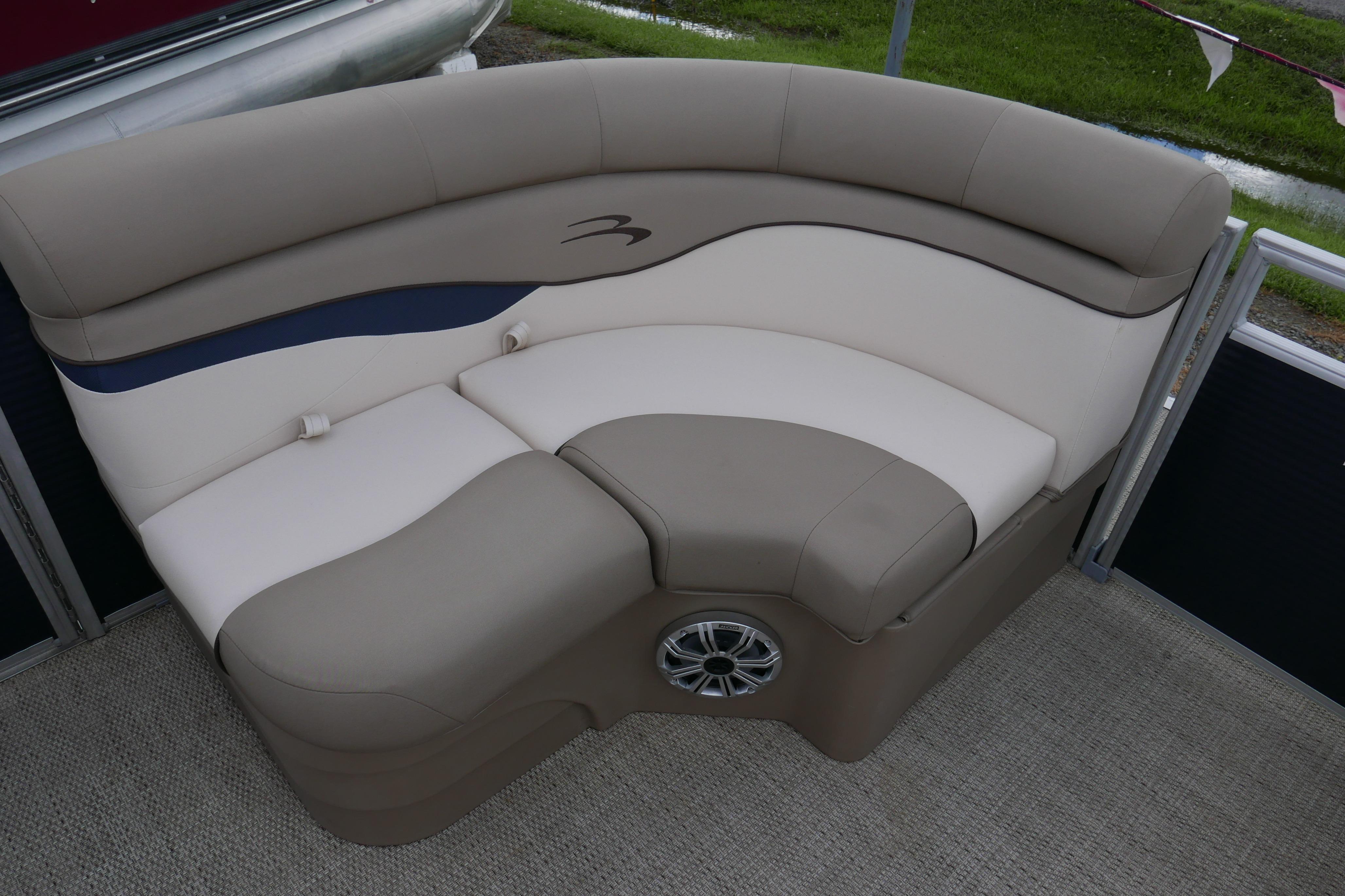 2019 Bennington SX 20 SLXP boat seating with beige upholstery and integrated speaker.