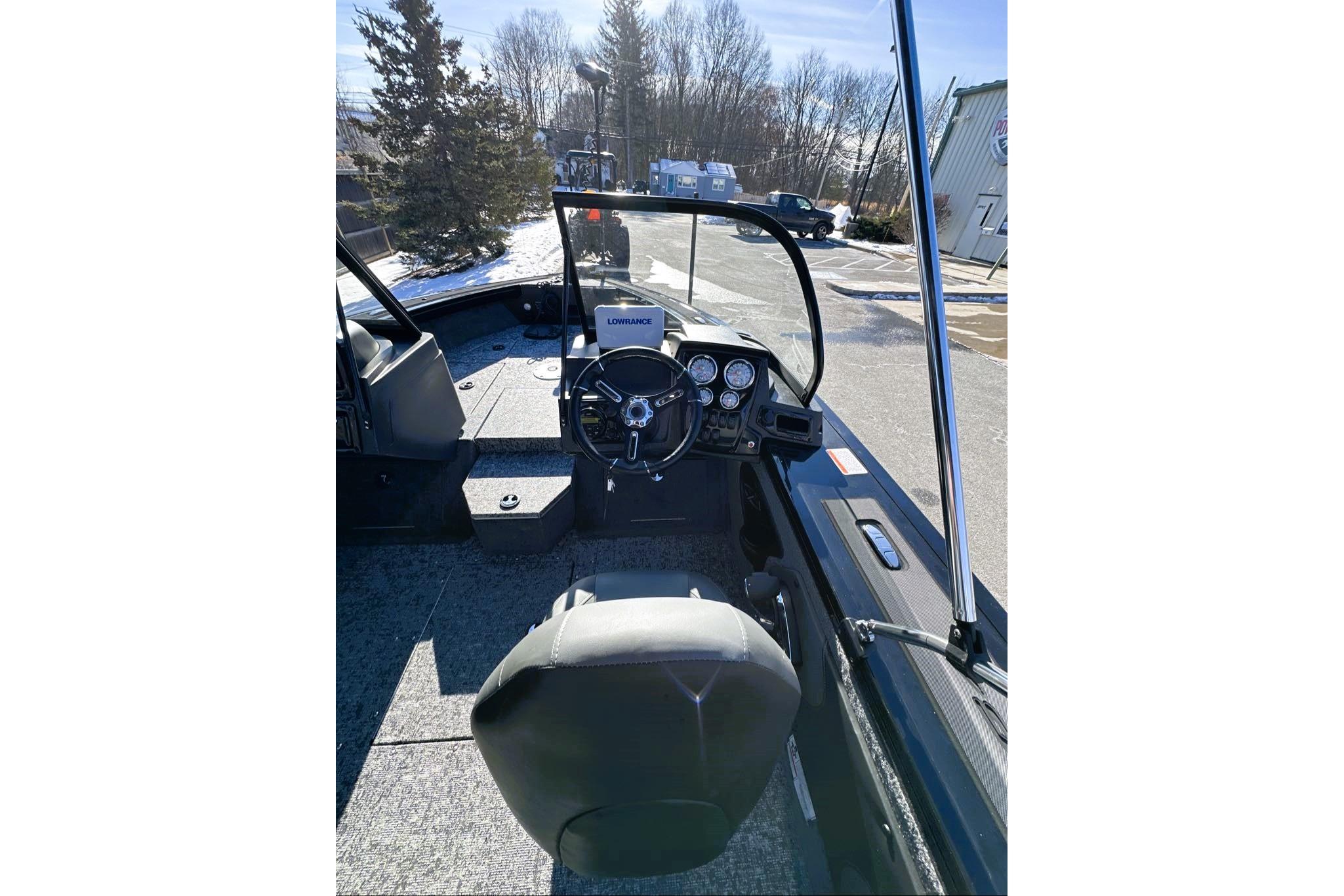 2026 Tracker Targa V-19 WT boat interior with steering wheel and dashboard controls.
