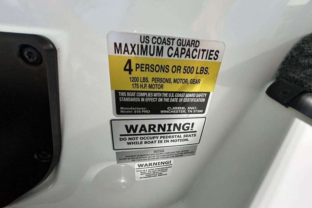 US Coast Guard capacity label on 2026 Phoenix 818 Pro boat, warning for 4 persons or 500 lbs.