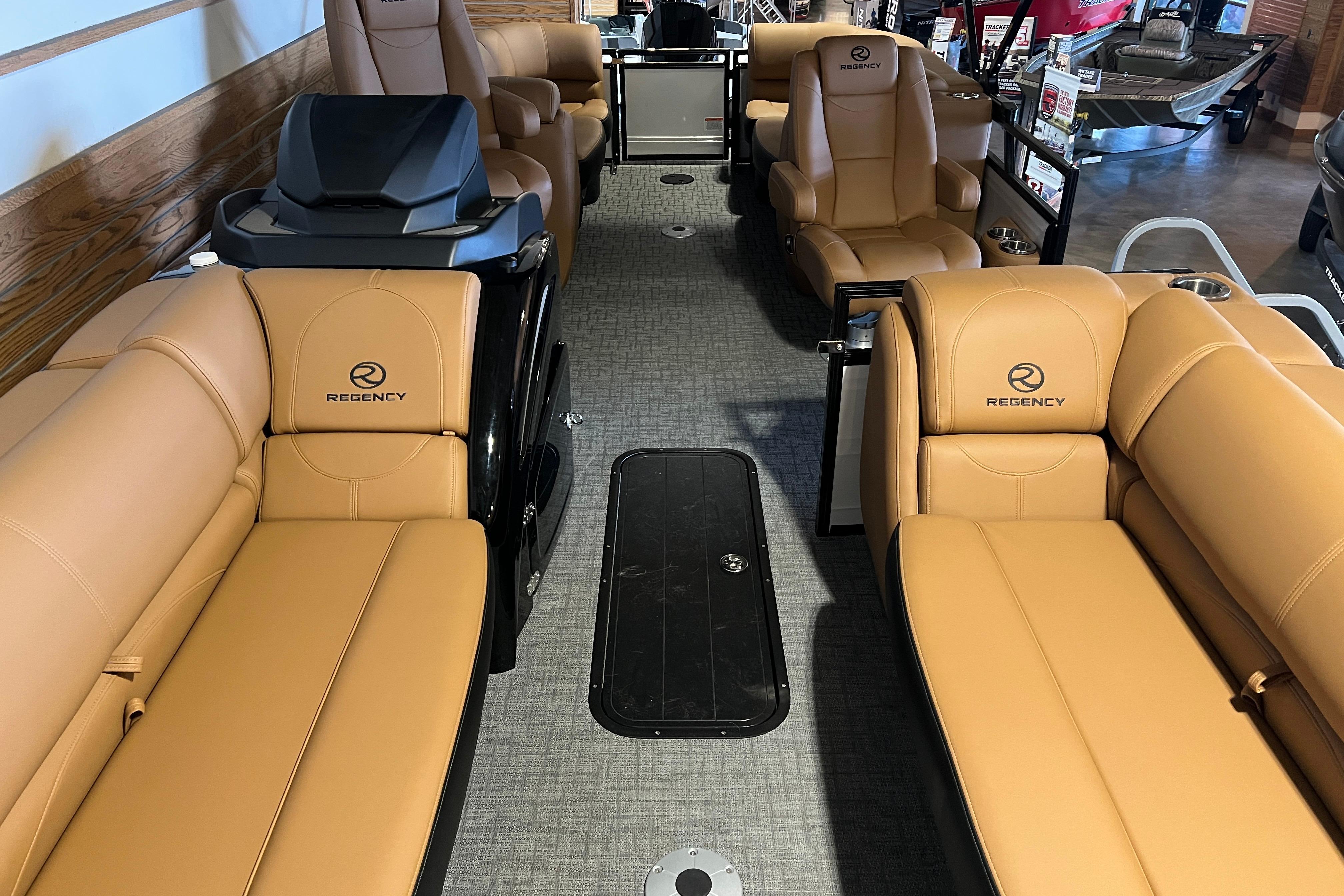 2026 Regency 230 DL boat interior with tan leather seating and modern design.
