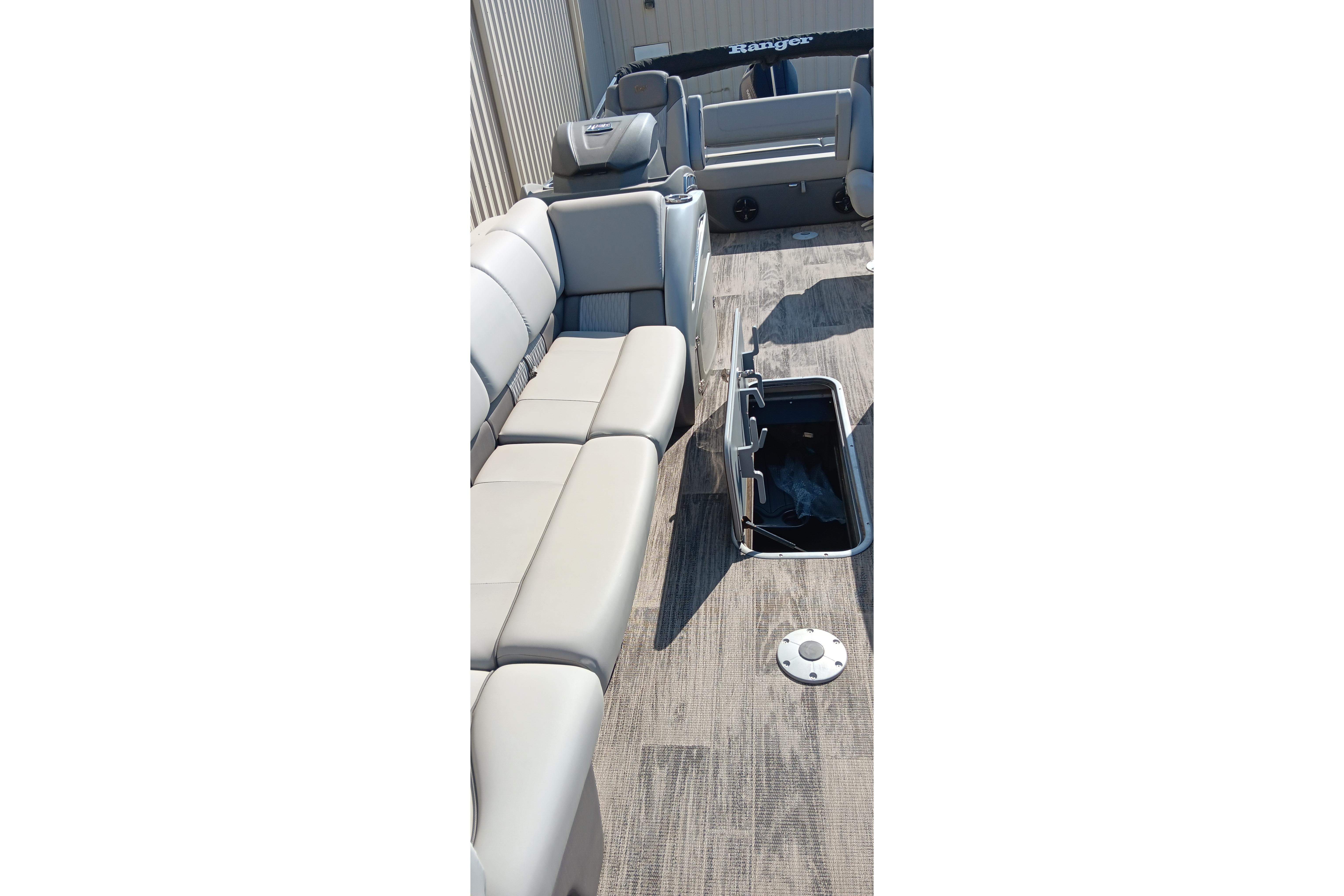 2023 Ranger 2500LS boat interior with gray seating and open storage compartment.