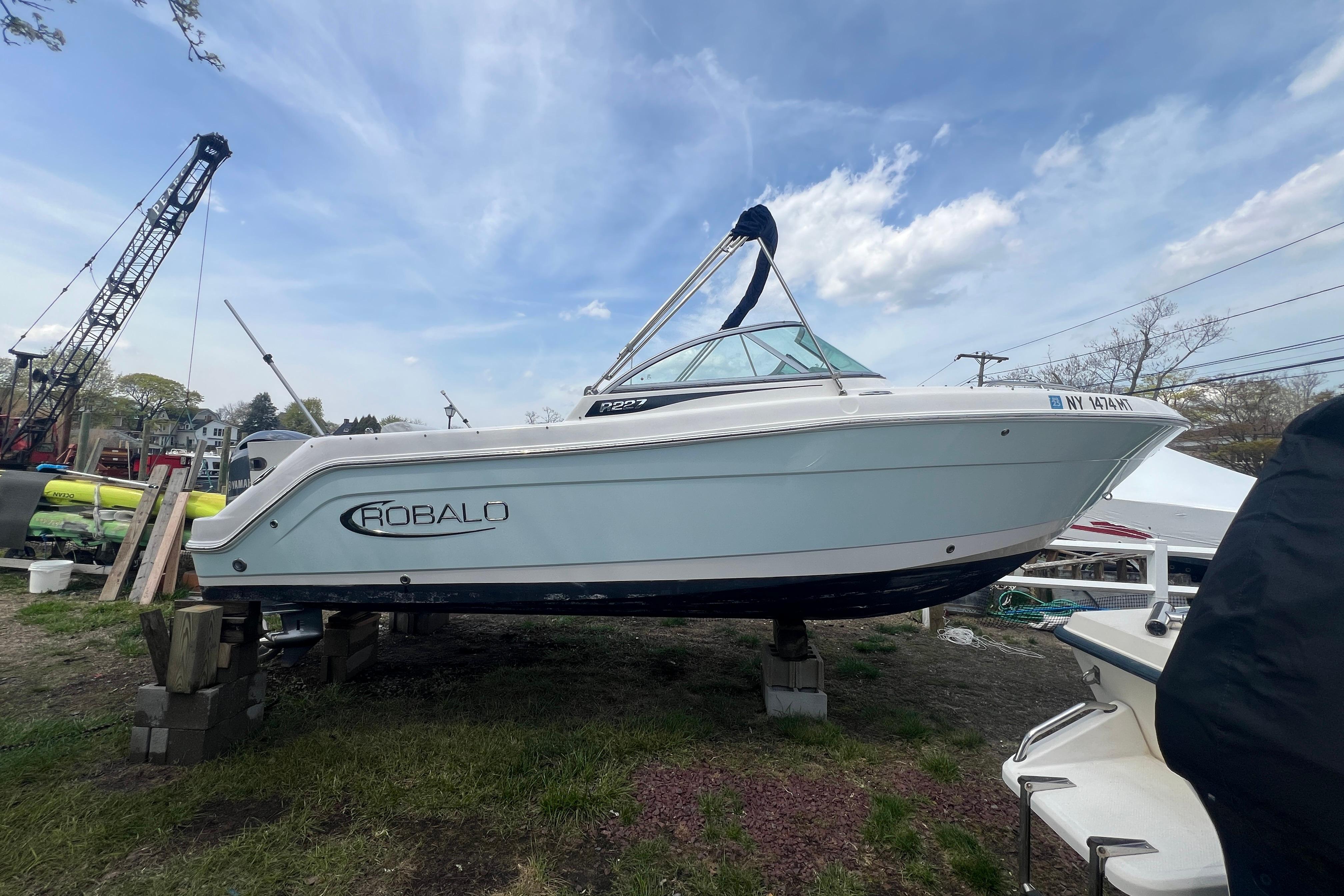 2022 Robalo R227 Dual Console boat on display outdoors.