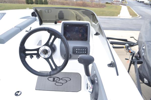 2025 Tahoe T21 boat dashboard with steering wheel and control panel.