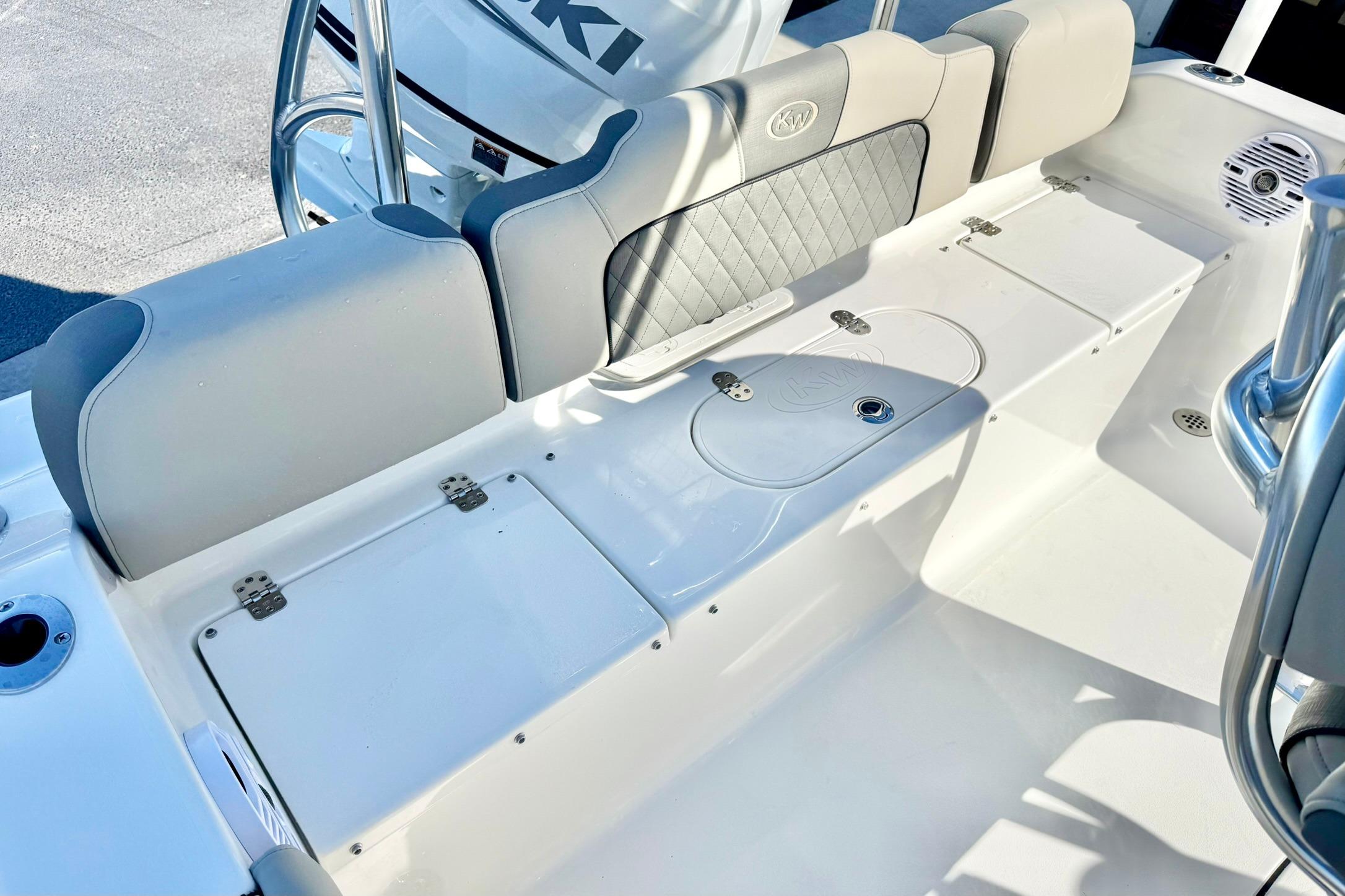 2026 Key West 189 FS boat interior with cushioned seating and storage compartments.