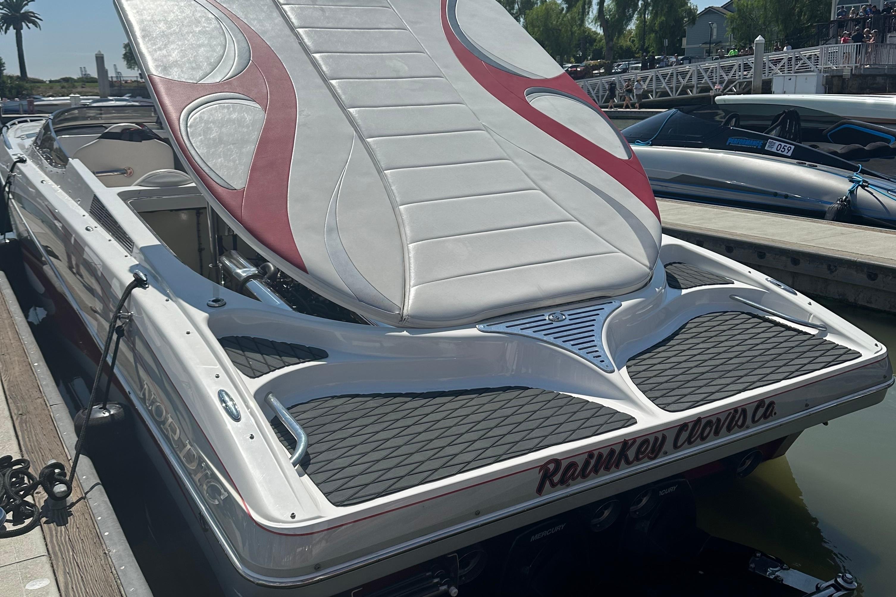 2013 Nordic 39 Poker Run boat docked, featuring sleek design and custom upholstery.