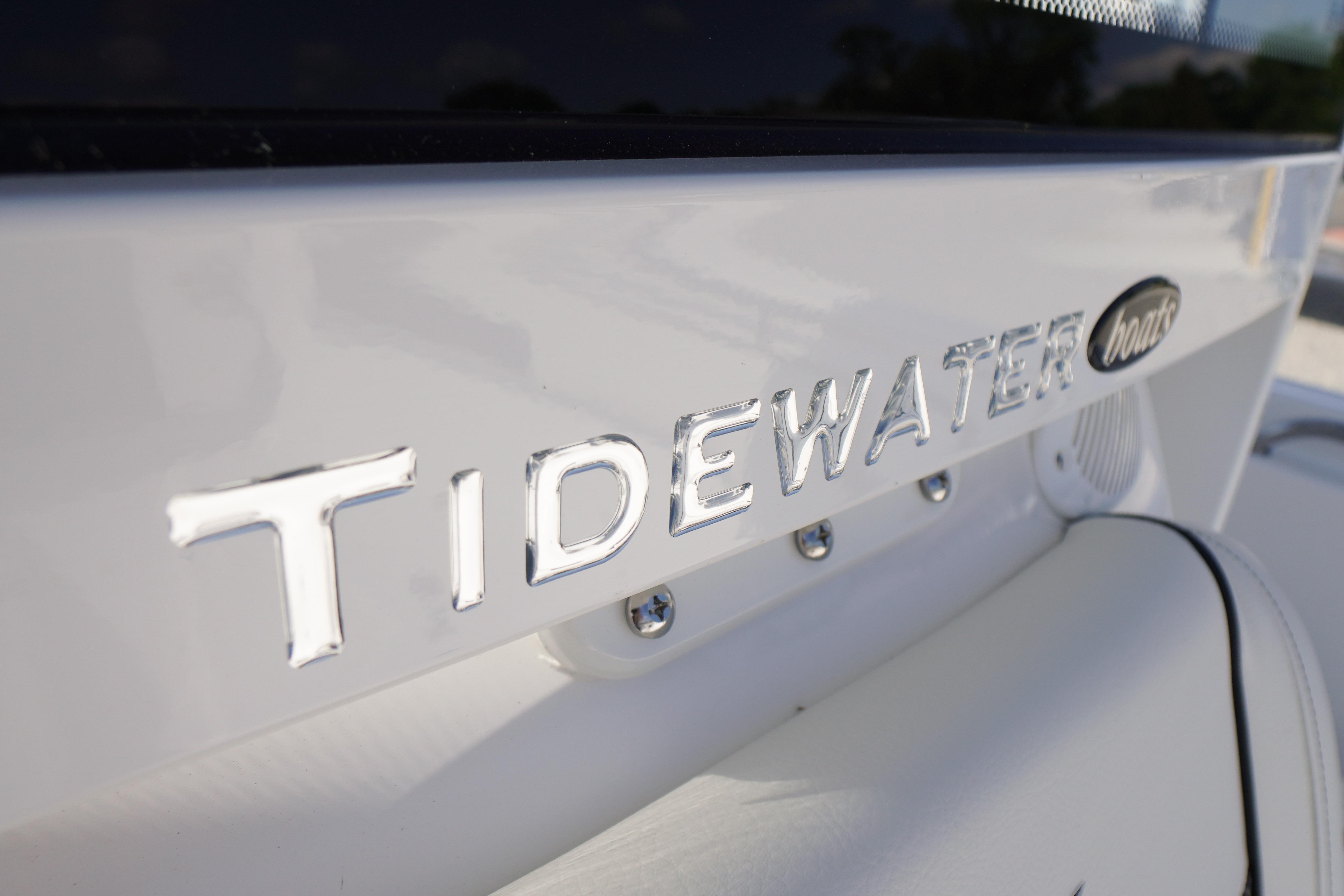 Close-up of 2026 Tidewater 220 CC Adventure boat logo on white surface.