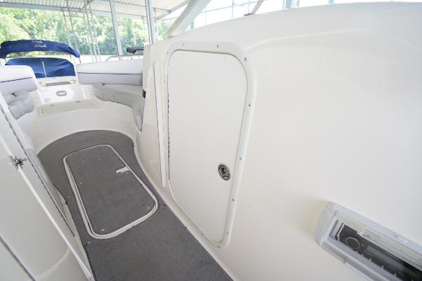 The image shows the interior of a 2010 Bryant 255 boat with white and gray details.
