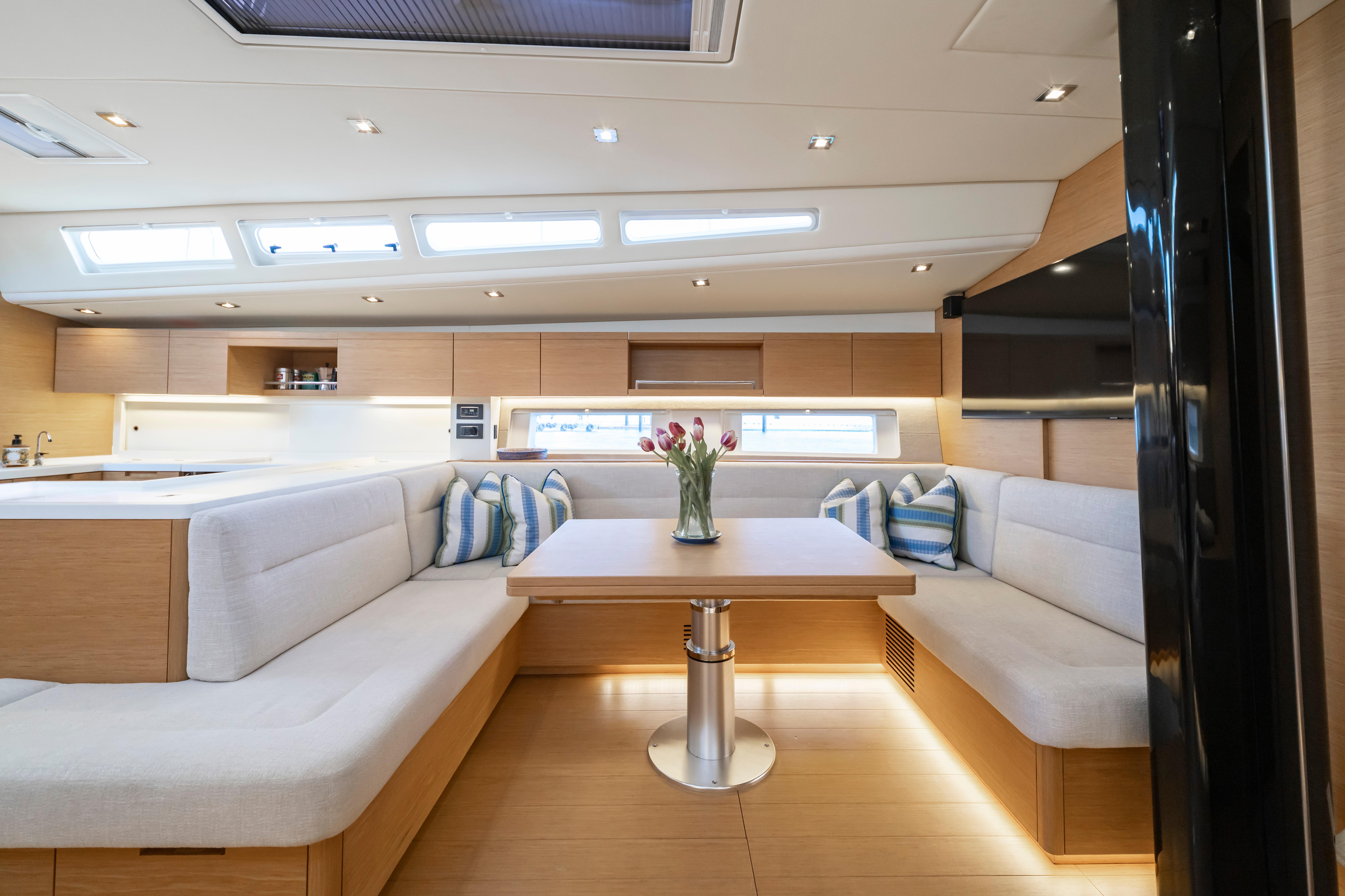 Luxurious interior of 2016 Grand Soleil 58 yacht with modern seating and elegant decor.