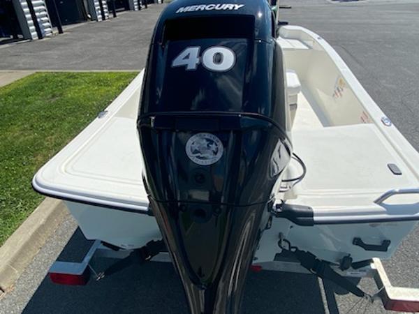 2024 Mako Pro Skiff 15 CC with Mercury 40 outboard engine on trailer.