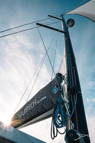2025 Nautitech 40 Open sailboat mast against a clear blue sky.