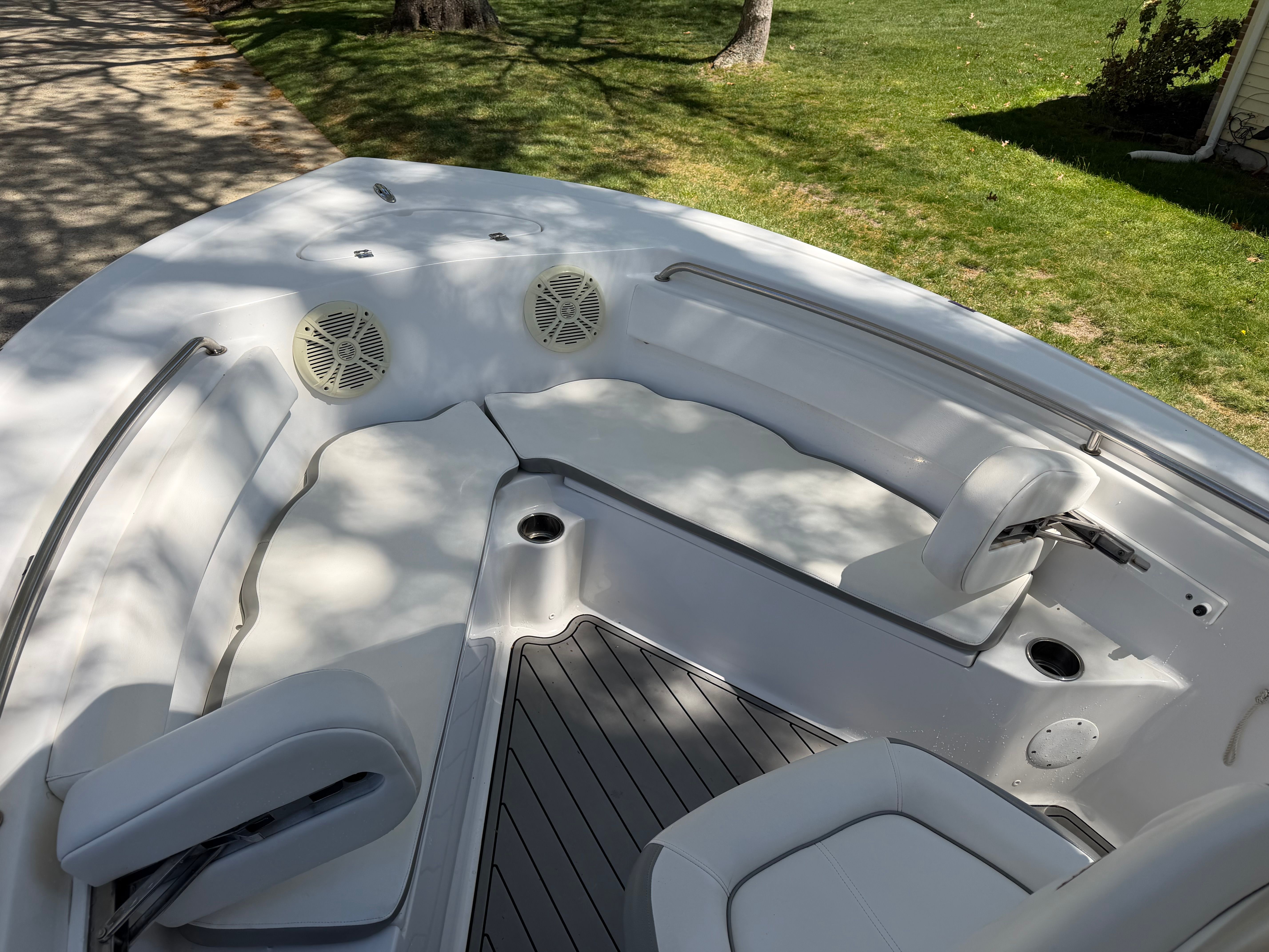 Interior view of a 2016 Tidewater 210 LXF boat with seating area.