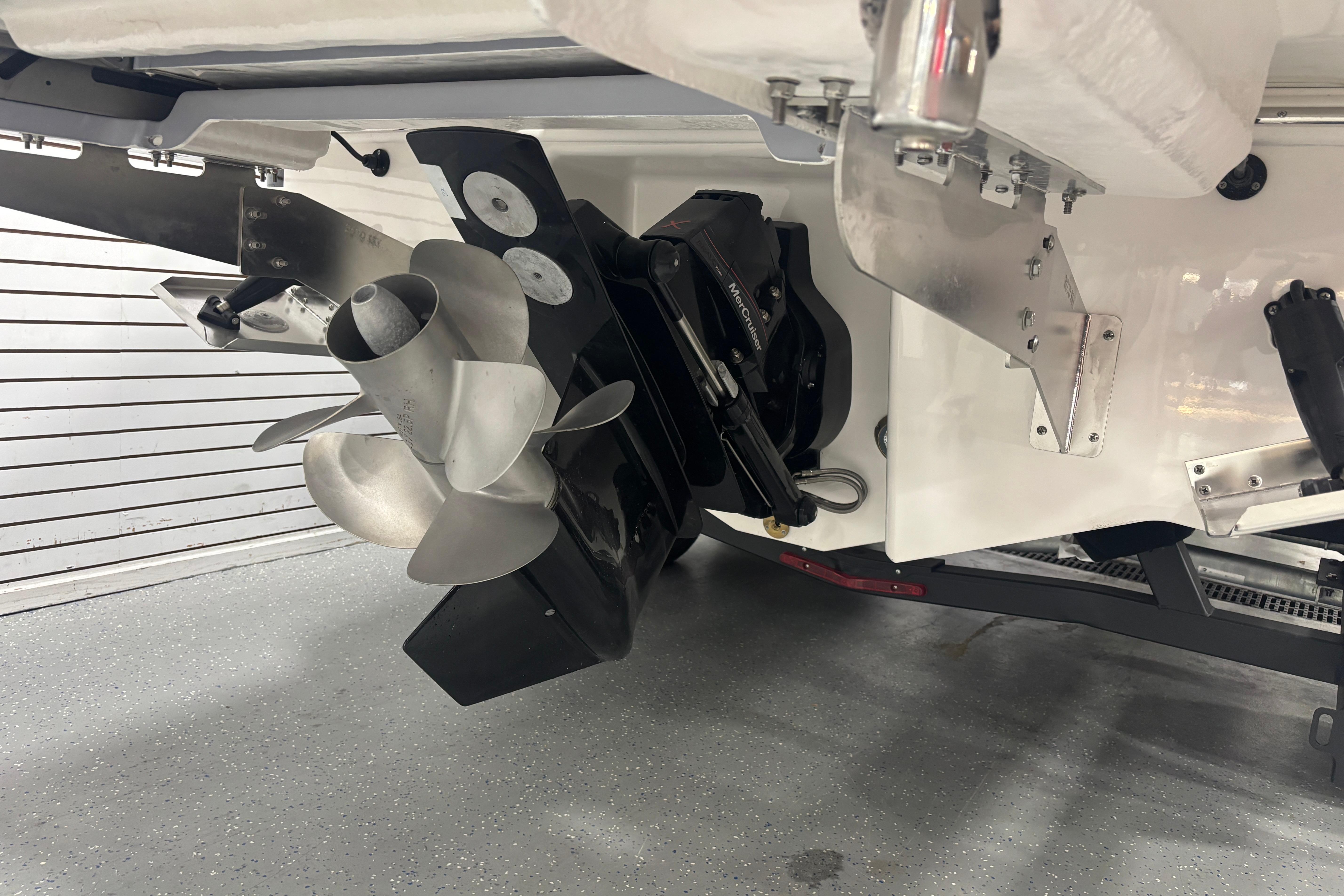 2026 Chaparral SSX 30 boat propeller and stern drive in a showroom.