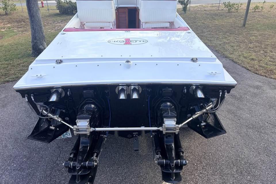 1983 Cigarette 24' Classic boat rear view, showcasing dual engines and sleek design.