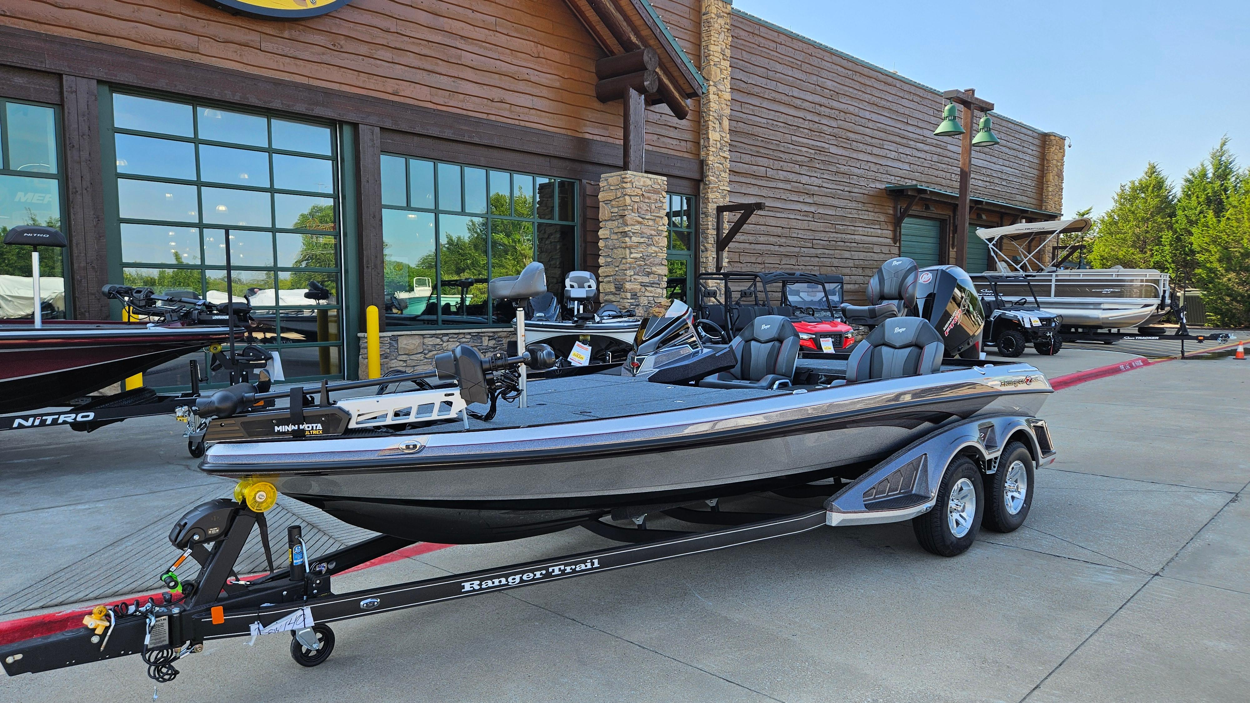 2025 Ranger Z520 boat on trailer outside a showroom.