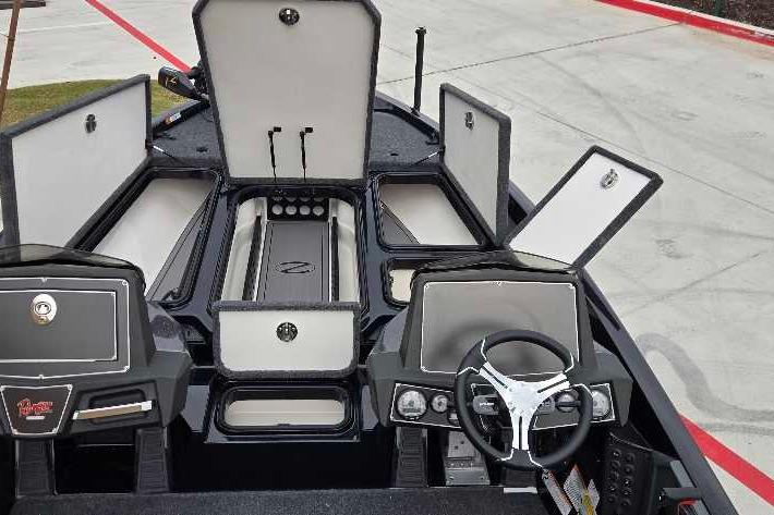 2025 Ranger Z518 boat interior with open storage compartments and modern steering console.