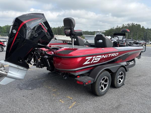 2025 Nitro Z19 Pro boat with red and black design, parked on a trailer.