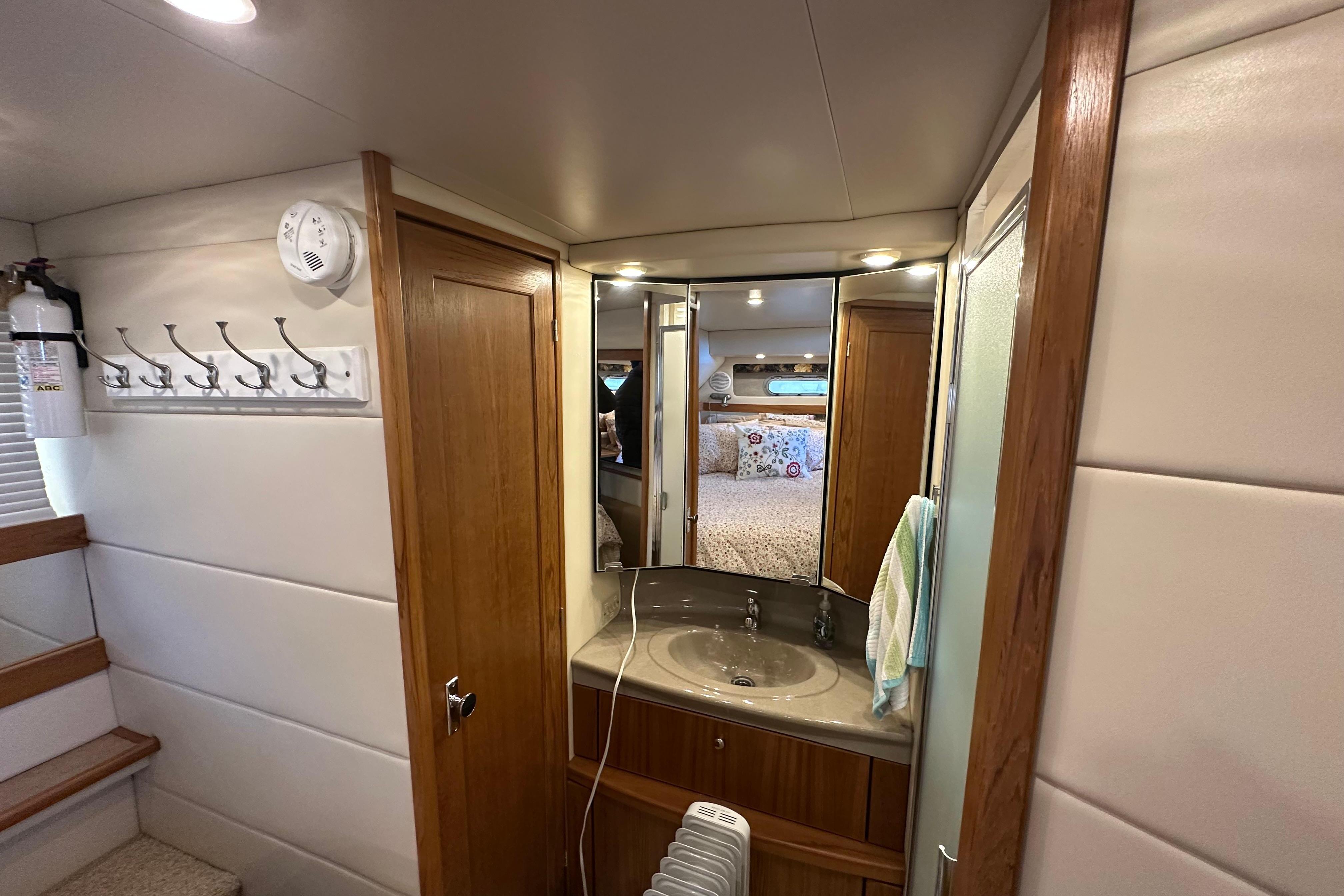 Interior of 2000 Bayliner 4087 Aft Cabin Motoryacht with bathroom vanity and mirror.