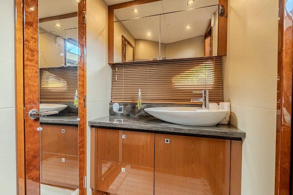 Luxurious bathroom interior of 2016 Sea Ray Sundancer 510 yacht with modern fixtures.