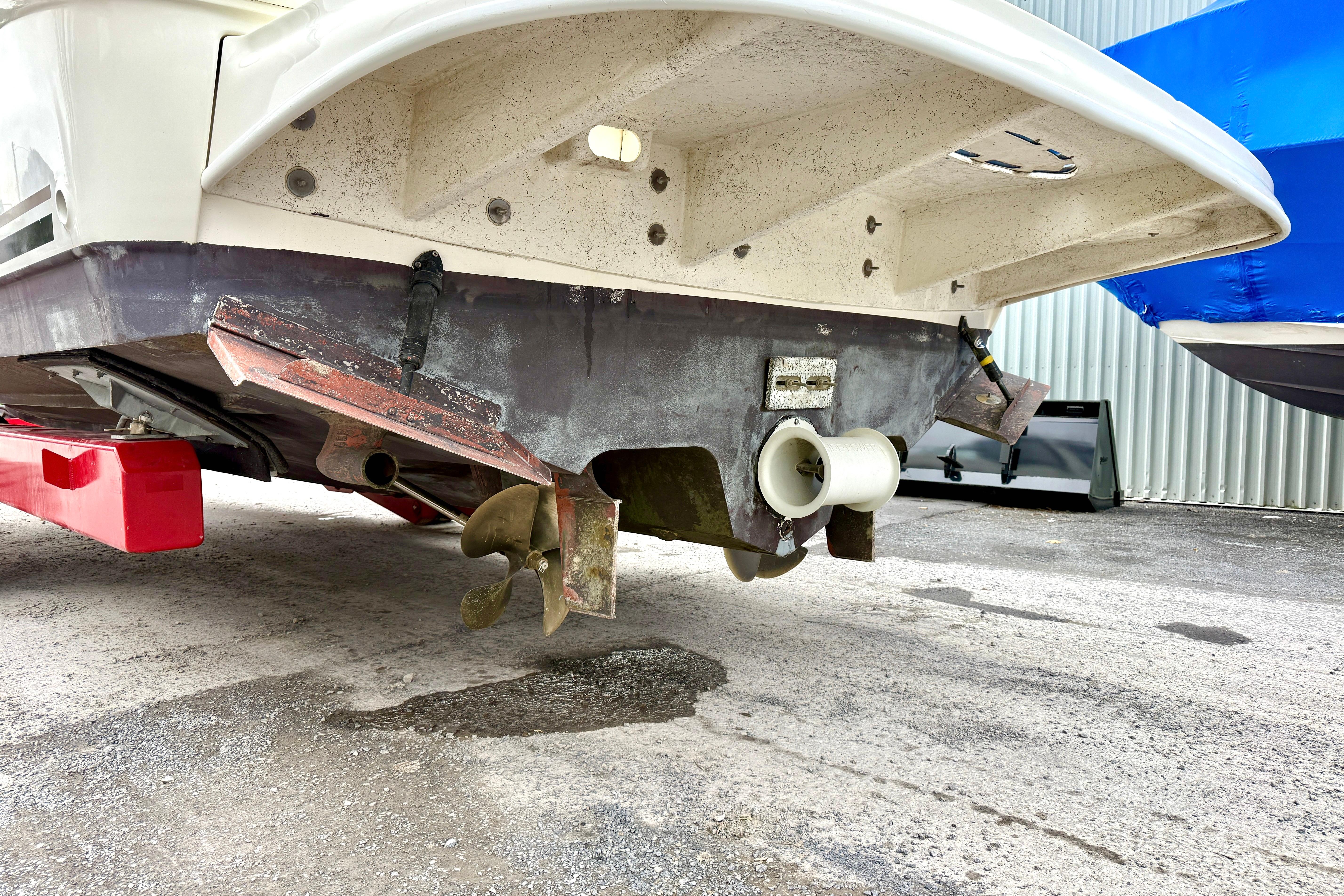 2004 Searay 360 Sundancer boat underside showing propeller and rudder details.