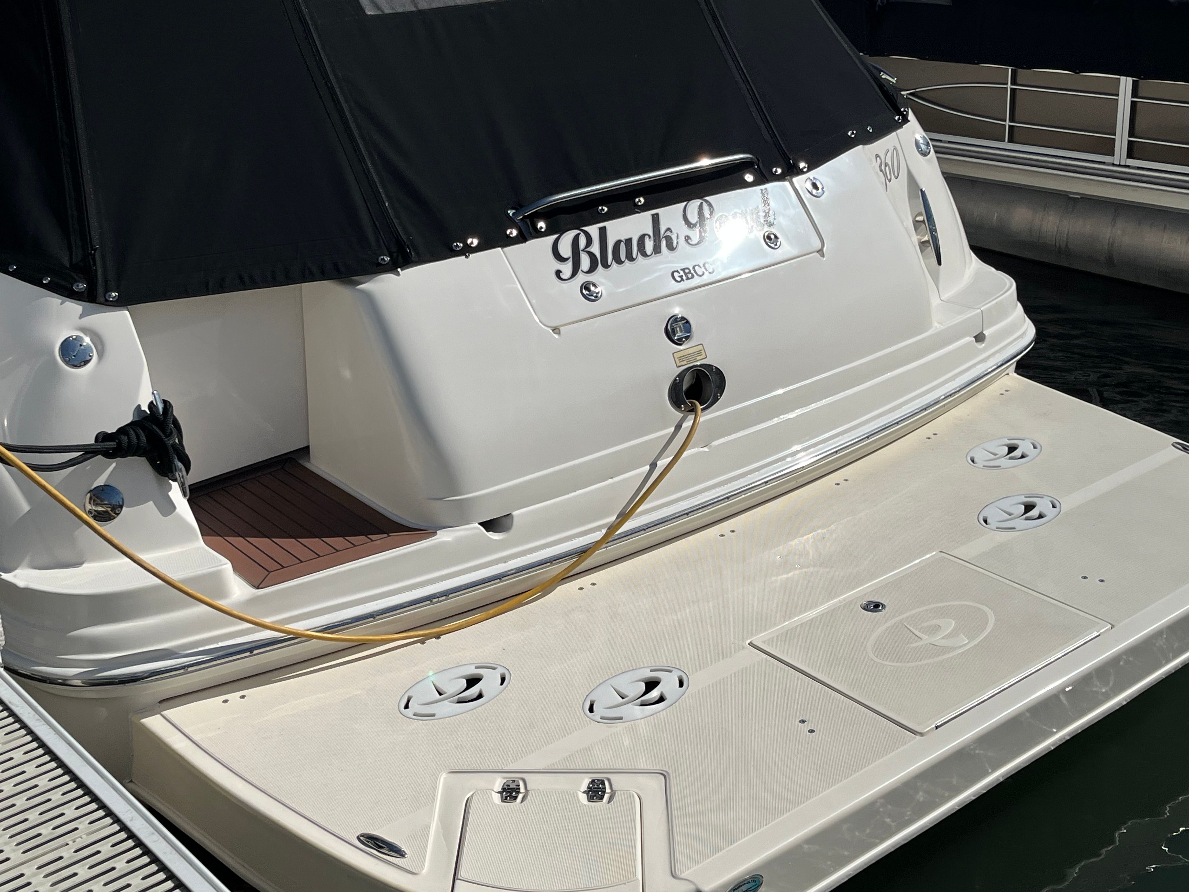Rear view of a 2005 Sea Ray Sundancer yacht at the dock.