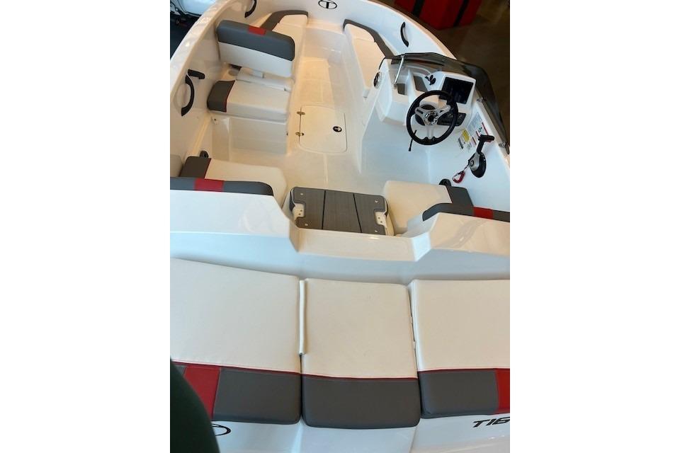 2026 Tahoe T16 boat interior with seating and steering wheel, featuring modern design elements.
