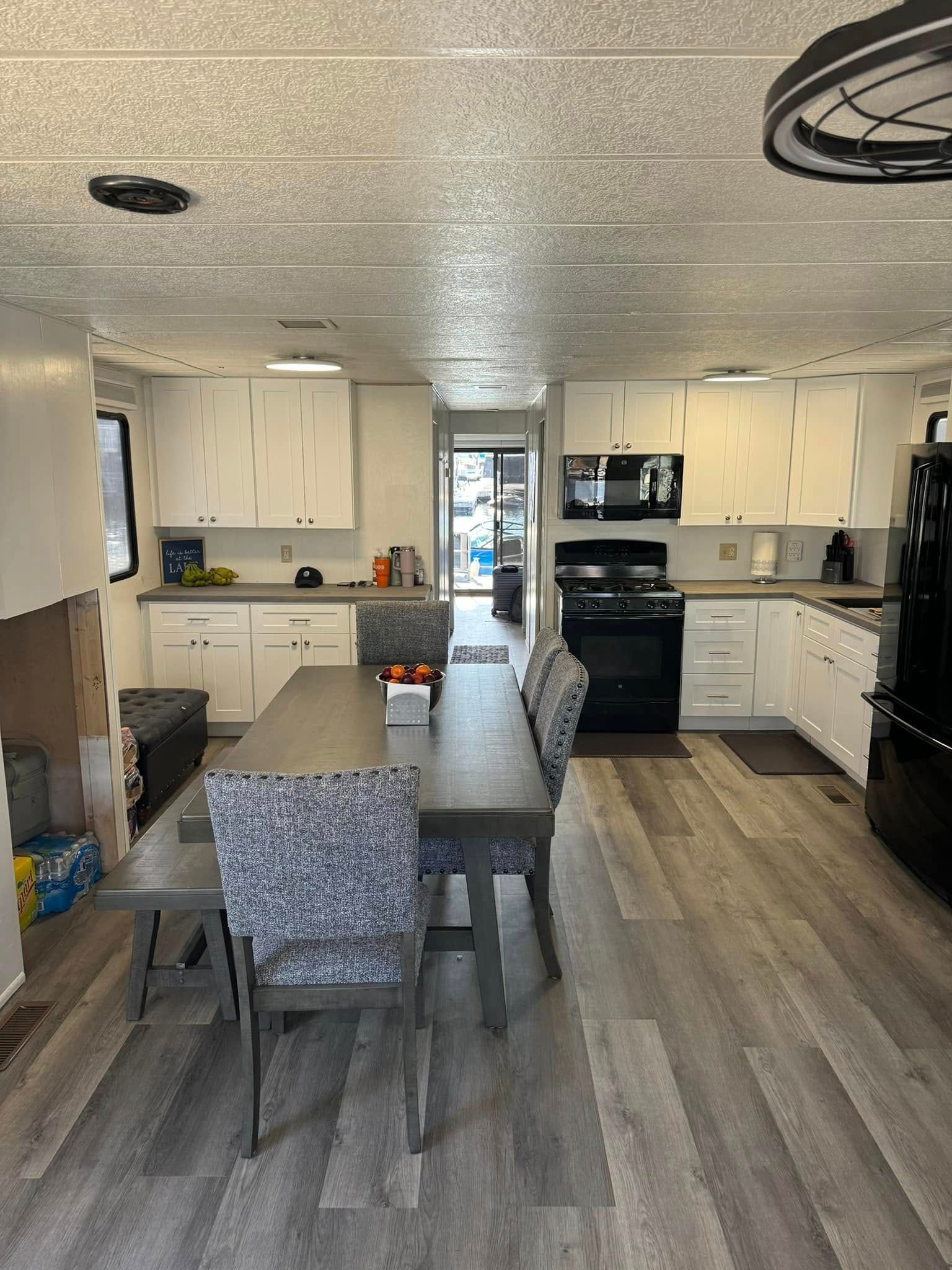 Interior of a 1993 Lakeview houseboat with modern kitchen.