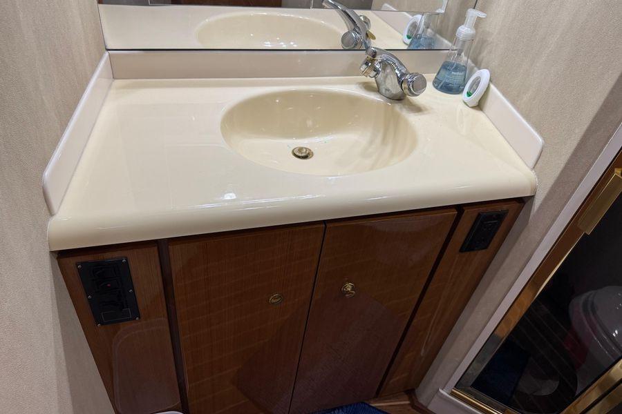 Bathroom sink area on a 2002 Viking 61 Enclosed Bridge yacht.