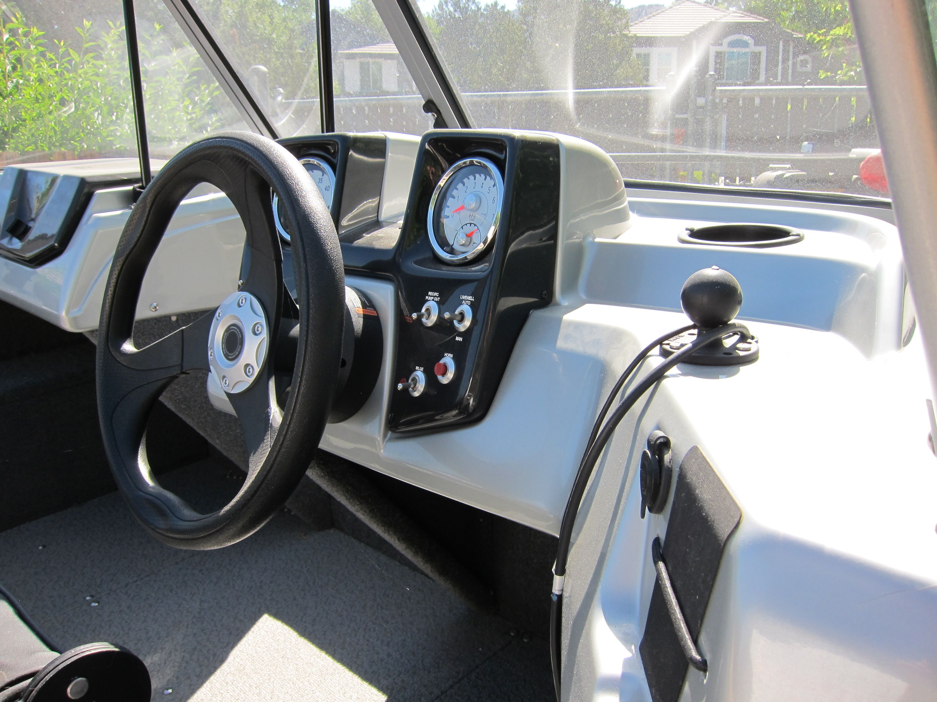 The image shows the cockpit of a 2018 Tracker Pro Guide V-16 WT.