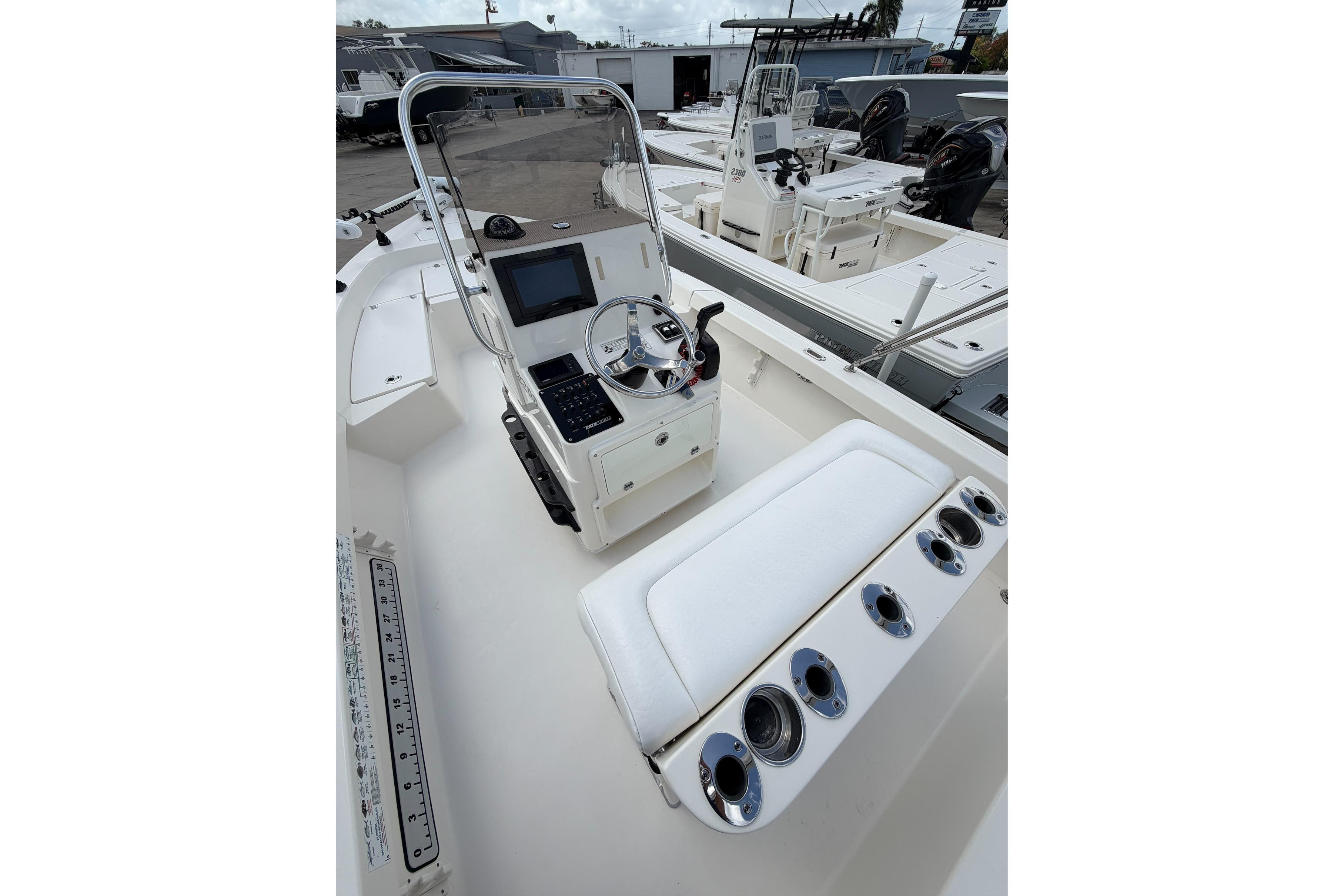 2017 Pathfinder 2200 TRS boat interior with console, seating, and rod holders.