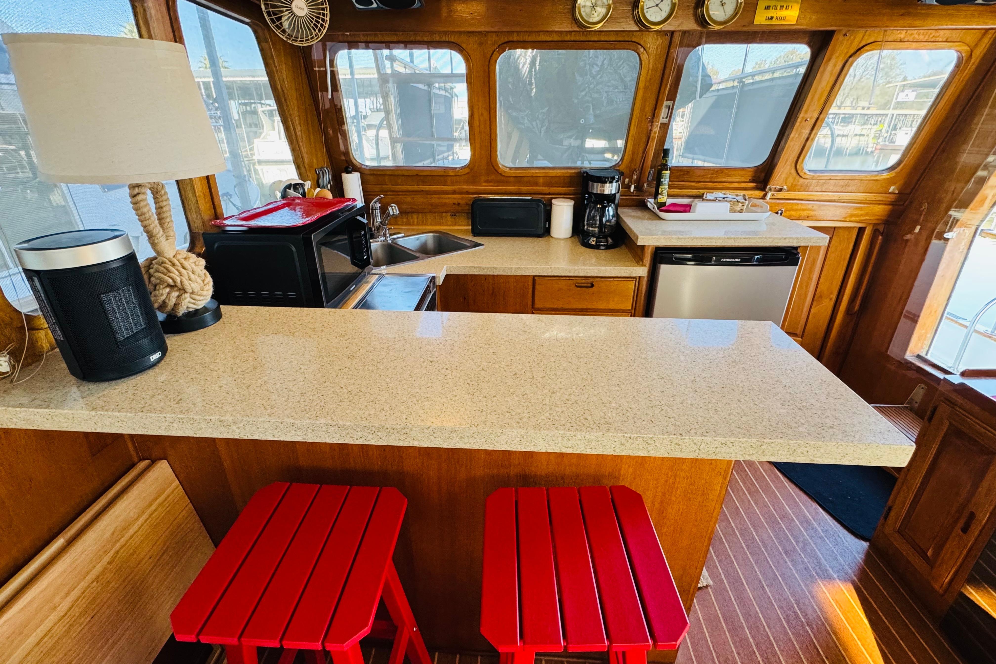 1978 Californian 42 LRC yacht interior with modern kitchen and red stools.